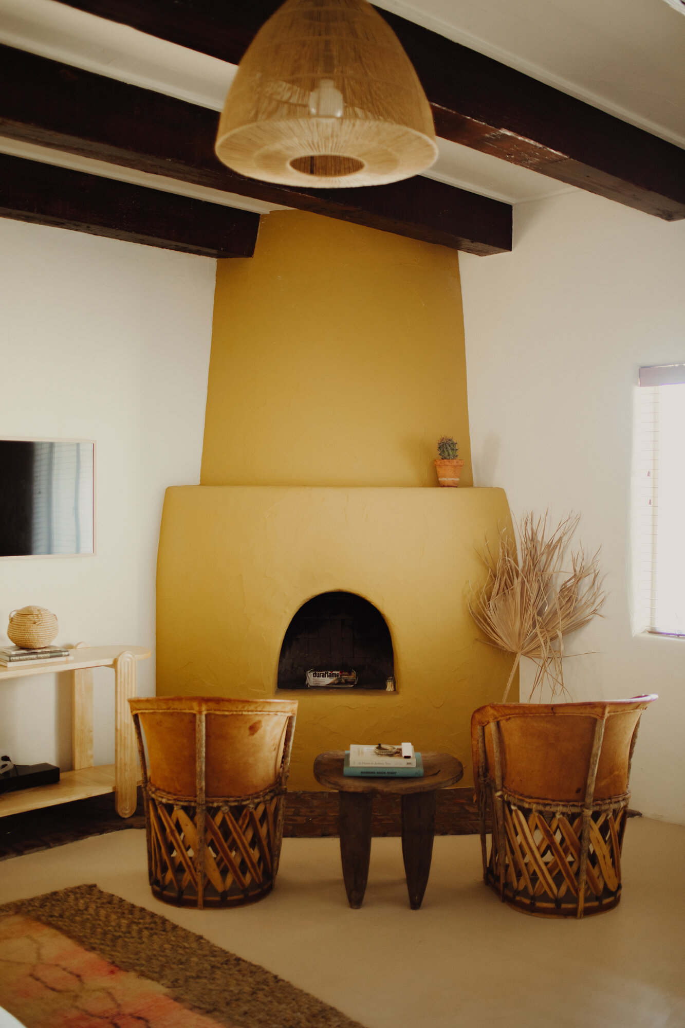 yucca-room-yellow-fireplace-joshua-treehouse-tucson-airbnb