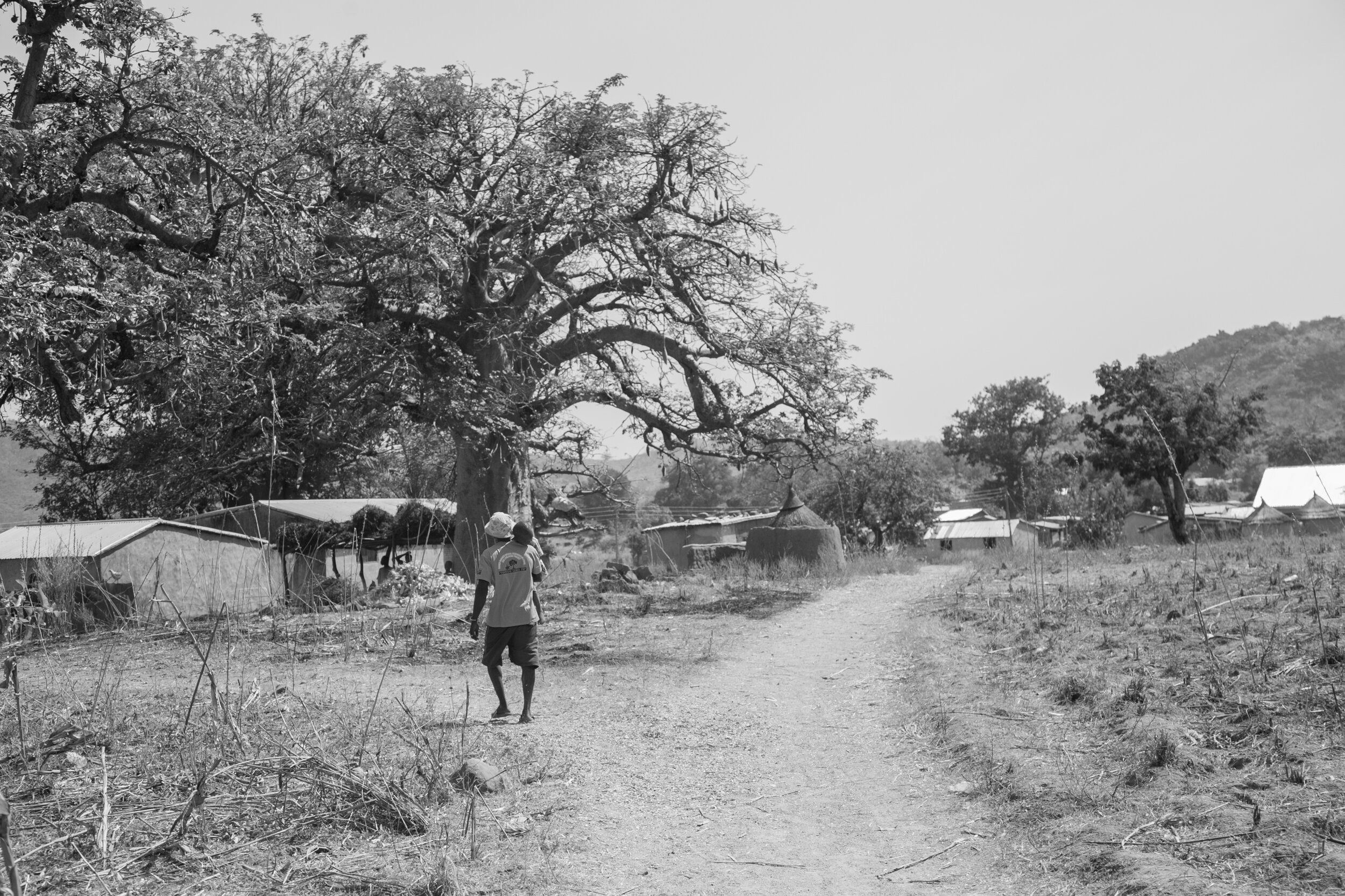Man and child by baobab.jpg
