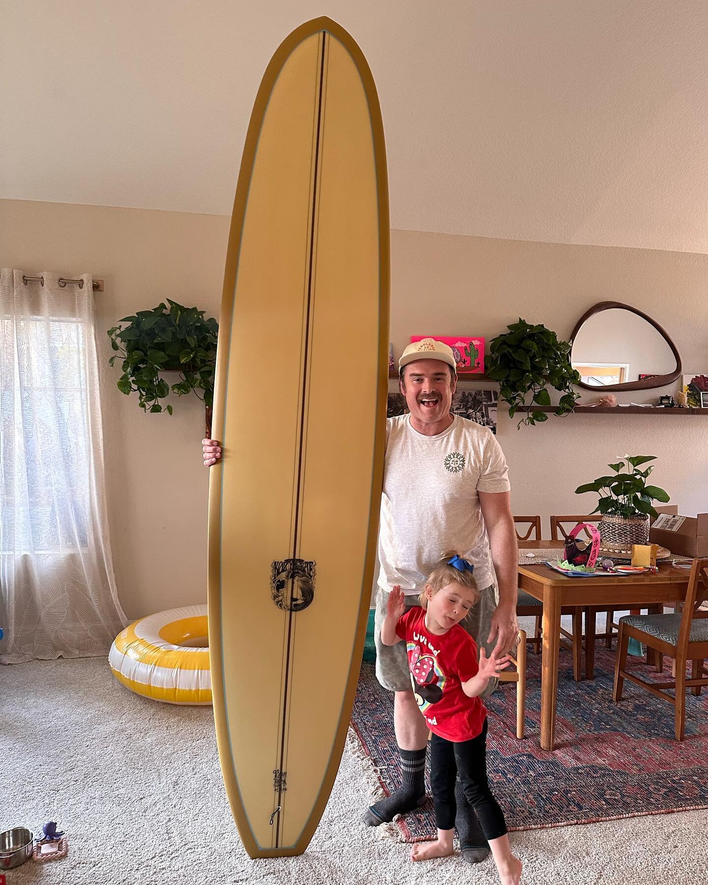 Chief Quality Control Officer and I taking a photo with this beauty - 9&rsquo;0 Phil Badone Pro Model :: Custom for Tim. 
.
.
Glassing by #oceanworksglassing @jim.hodges 
.
.
#handshaped #surfcraft #california #letsparty #surf #🌞 #kozmcraesurfingboa