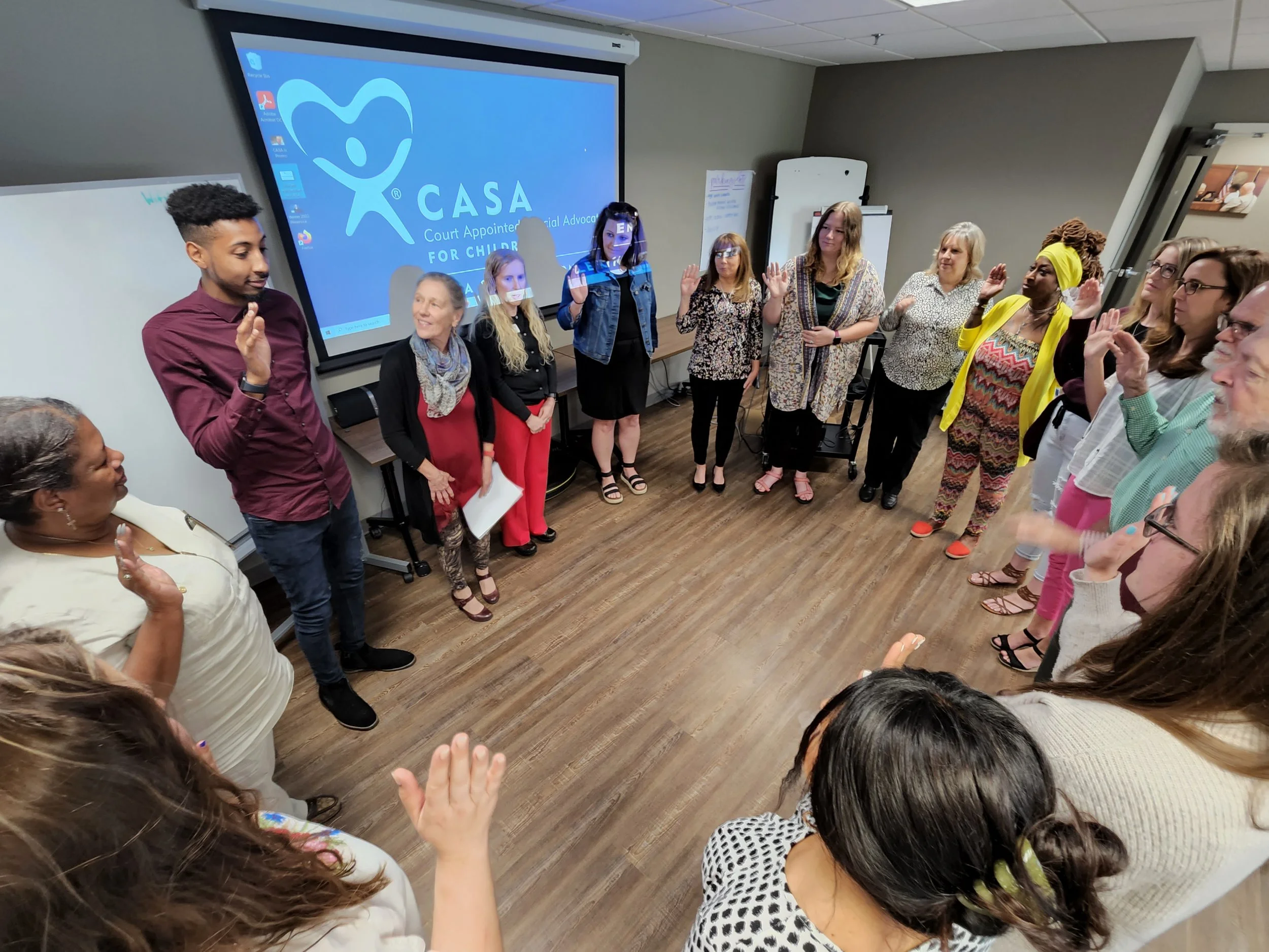 New CASA of Lexington volunteers are sworn in by Fayette County family court Judge Lucinda Masterton, fourth from left at the CASA of Lexington office May 24.