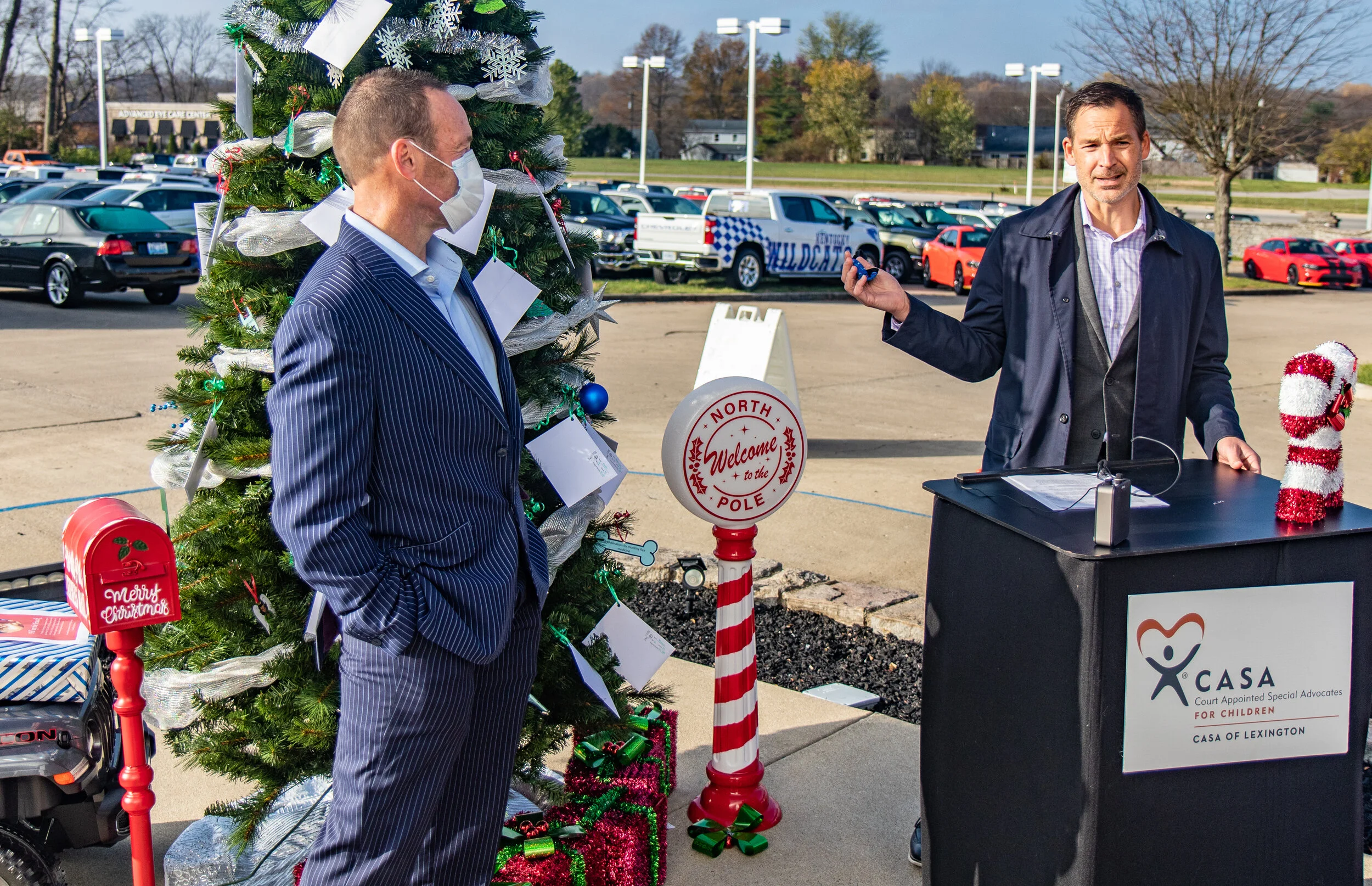 Dusty Cummins, left, and Josh Cummins participate in Thursday’s CASA Angel Tree lighting event at Dan Cummins of Georgetown.