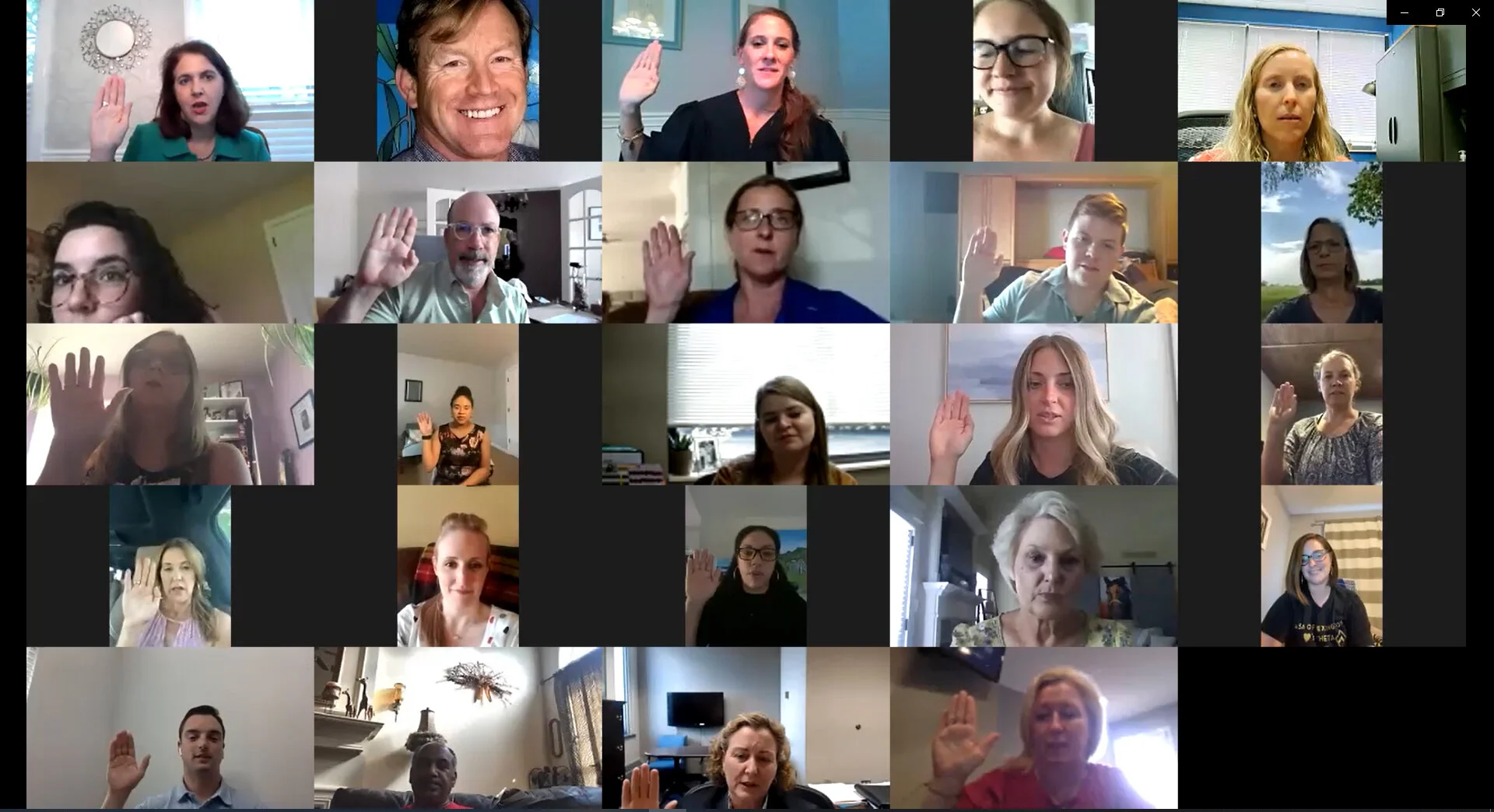Fayette County Family Court Judge Libby Messer, center top, swears in 11 new CASA volunteers and two staff members over Zoom on Tuesday evening.