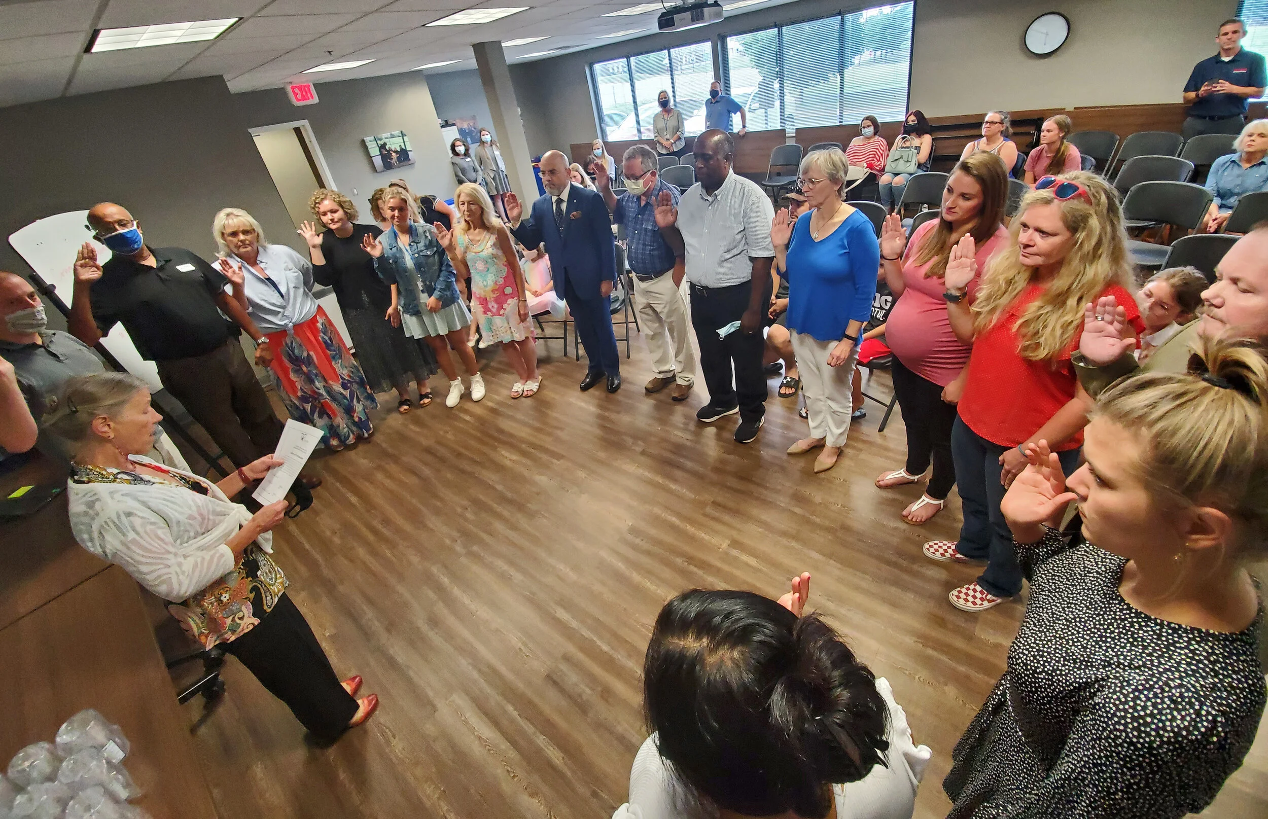 Fayette County Family Court Judge Lucinda Masterton, bottom left, swears in new CASA volunteers at the CASA of Lexington office on Aug. 3.