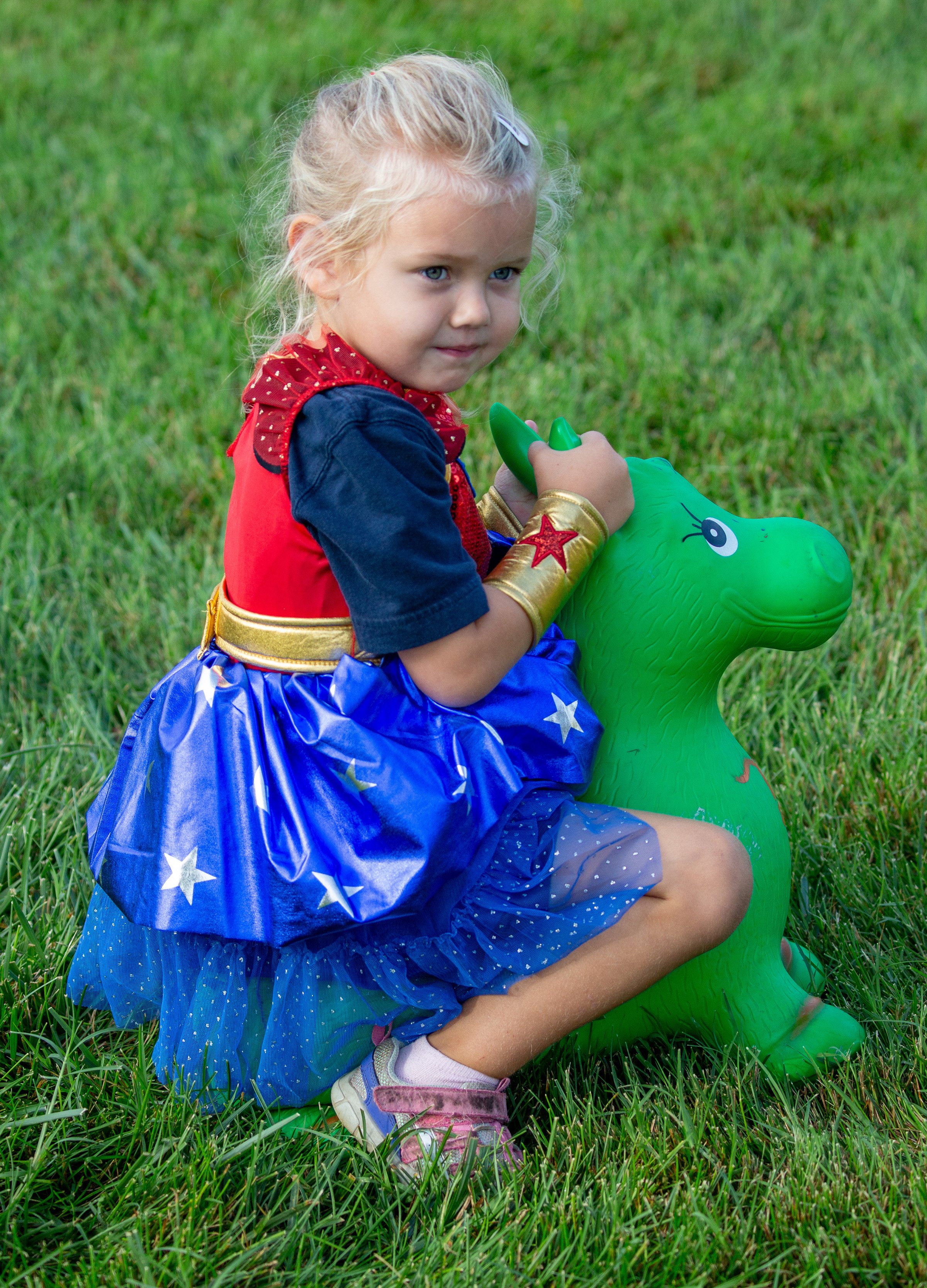 Little Wonder Girl Rides Bouncy Donkey.jpg