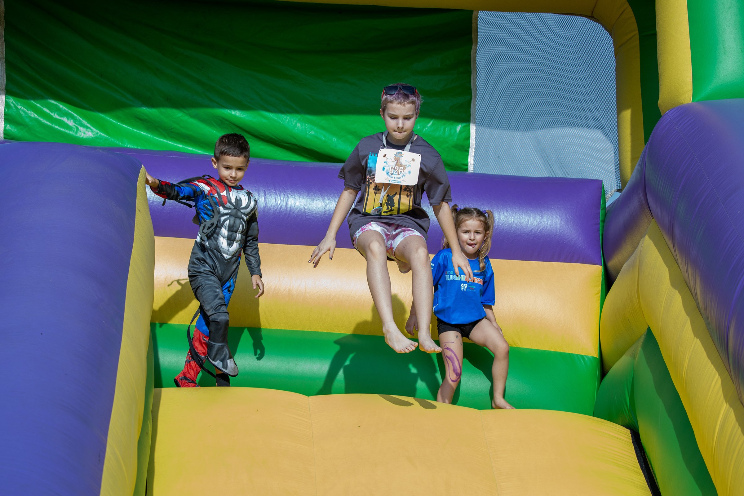 Three Kids on Inflatable Slide.jpg