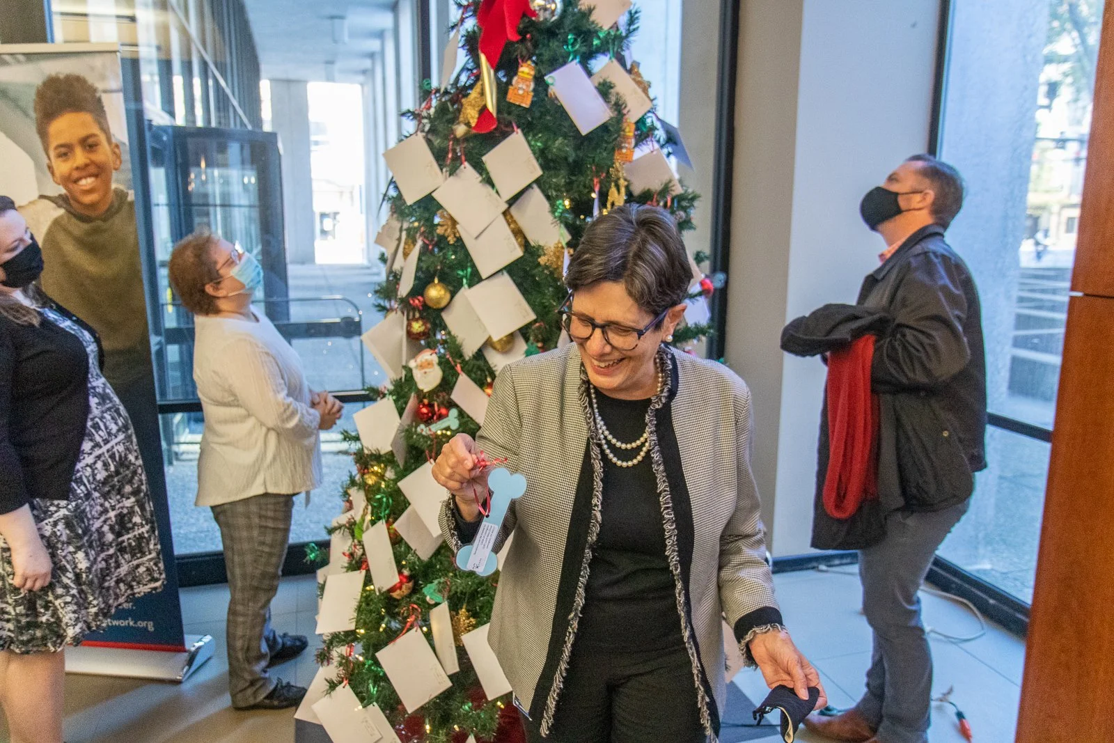 Lexington Mayor Linda Gorton picks an ornament from the Fayette County CASA Angel Tree in November 2021.