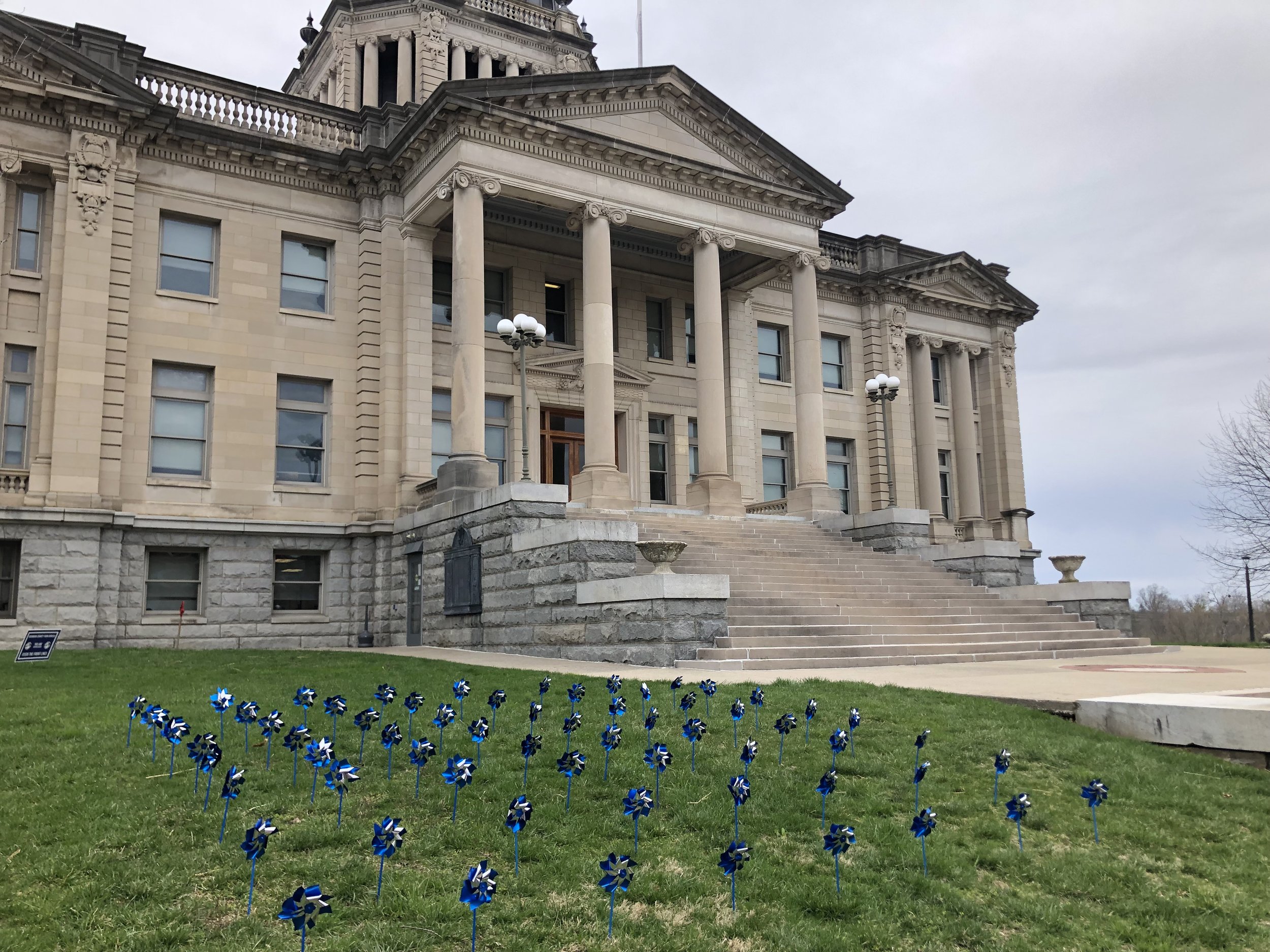 Pinwheels planted in front of the courthouse in Paris, Ky.