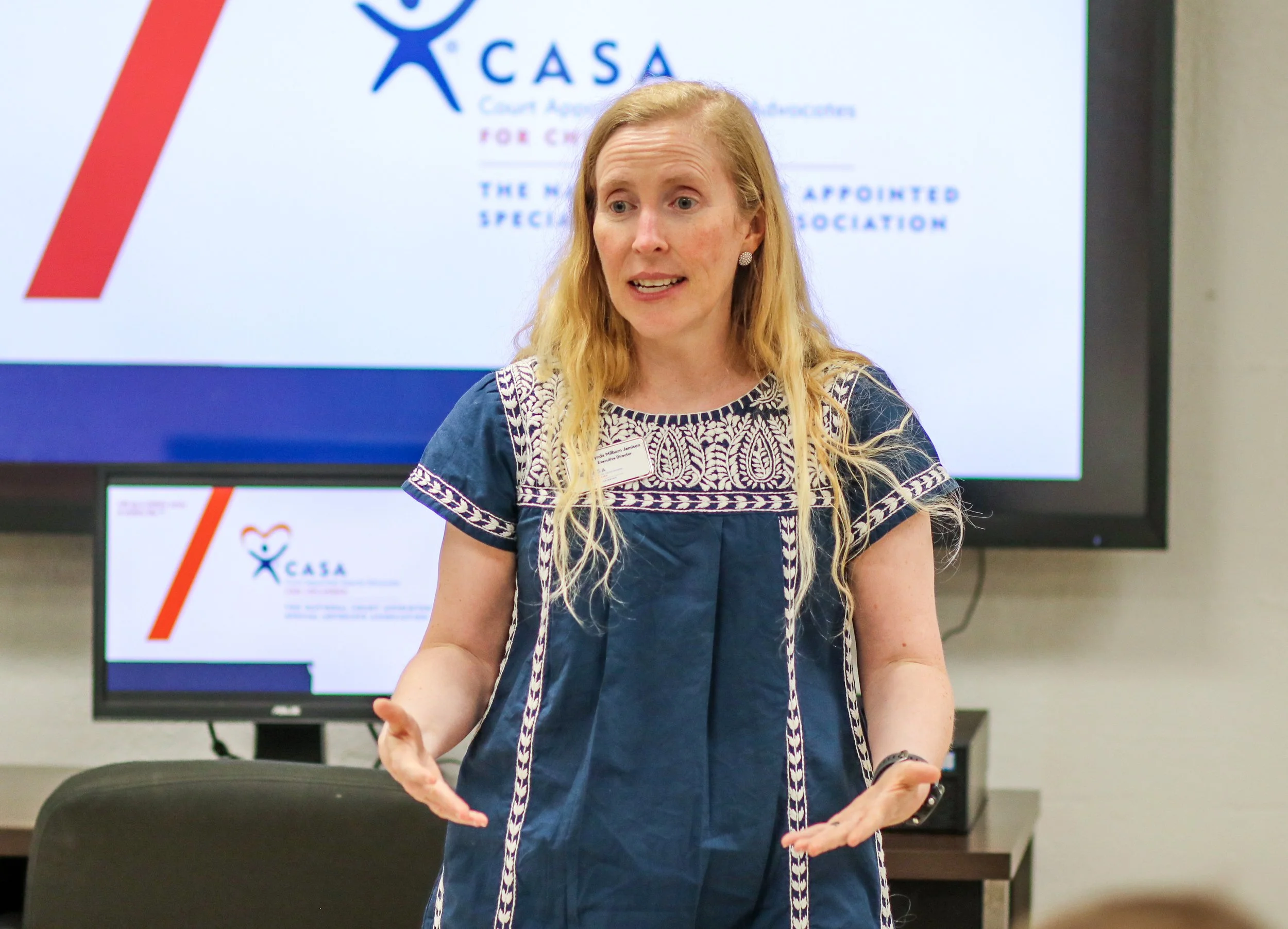 CASA Executive Director Melynda Jamison speaks during the swearing in ceremony.