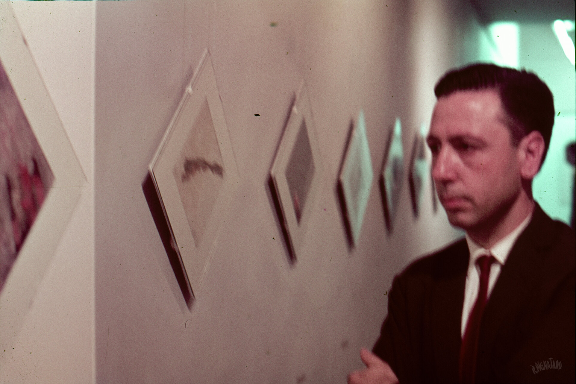 Roberto Pignataro by exhibition wall