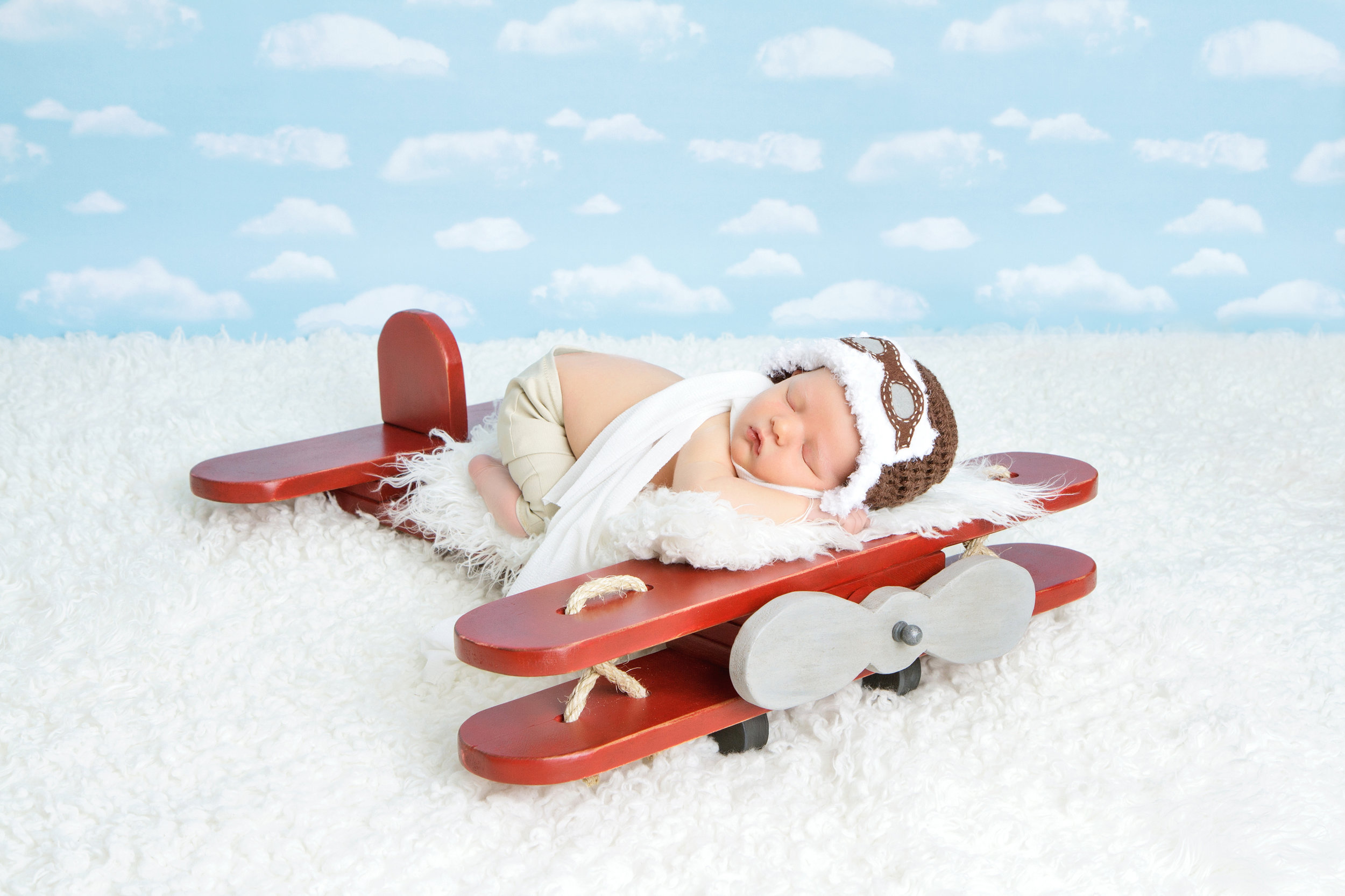 newborn boy red airplane.jpg