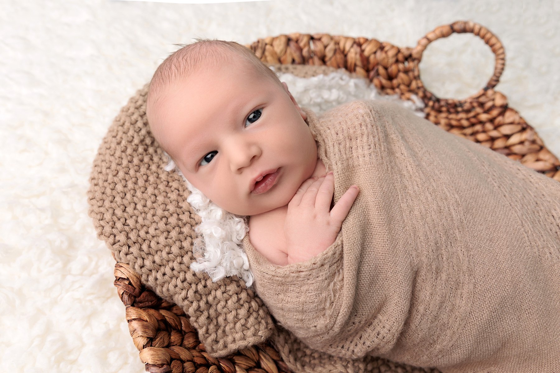 newborn-awake-wicker-tray.jpg