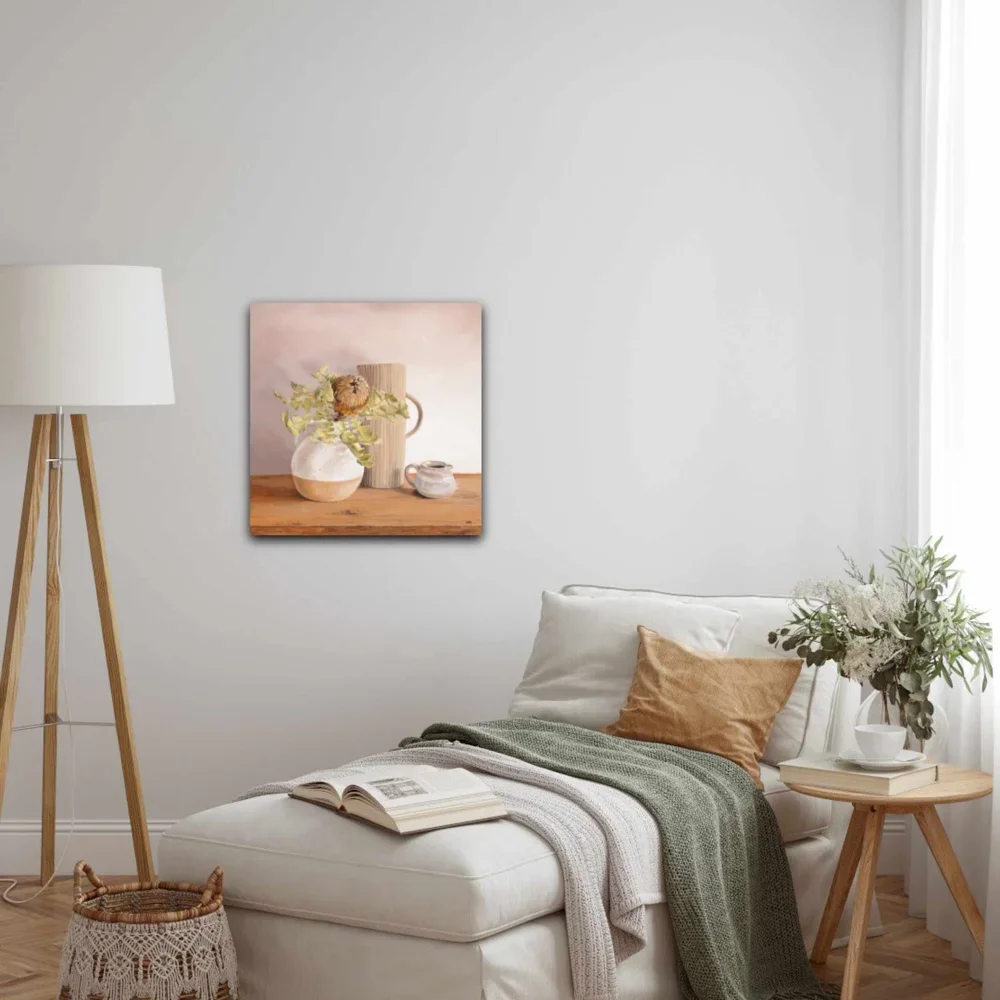 The Gathering by Heidi Emma on a wall above a neutral chaise lounge with lamp