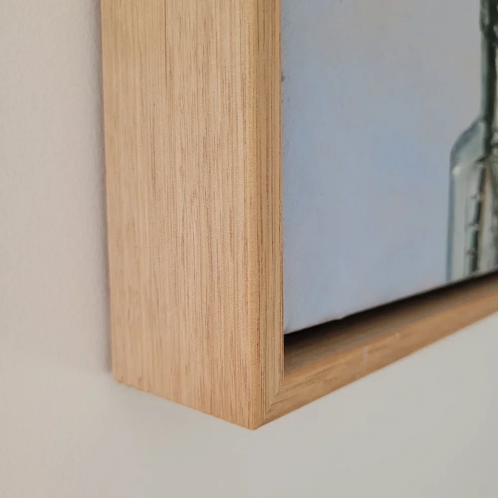 detail of oak framing of stretched canvas of Daisy Love