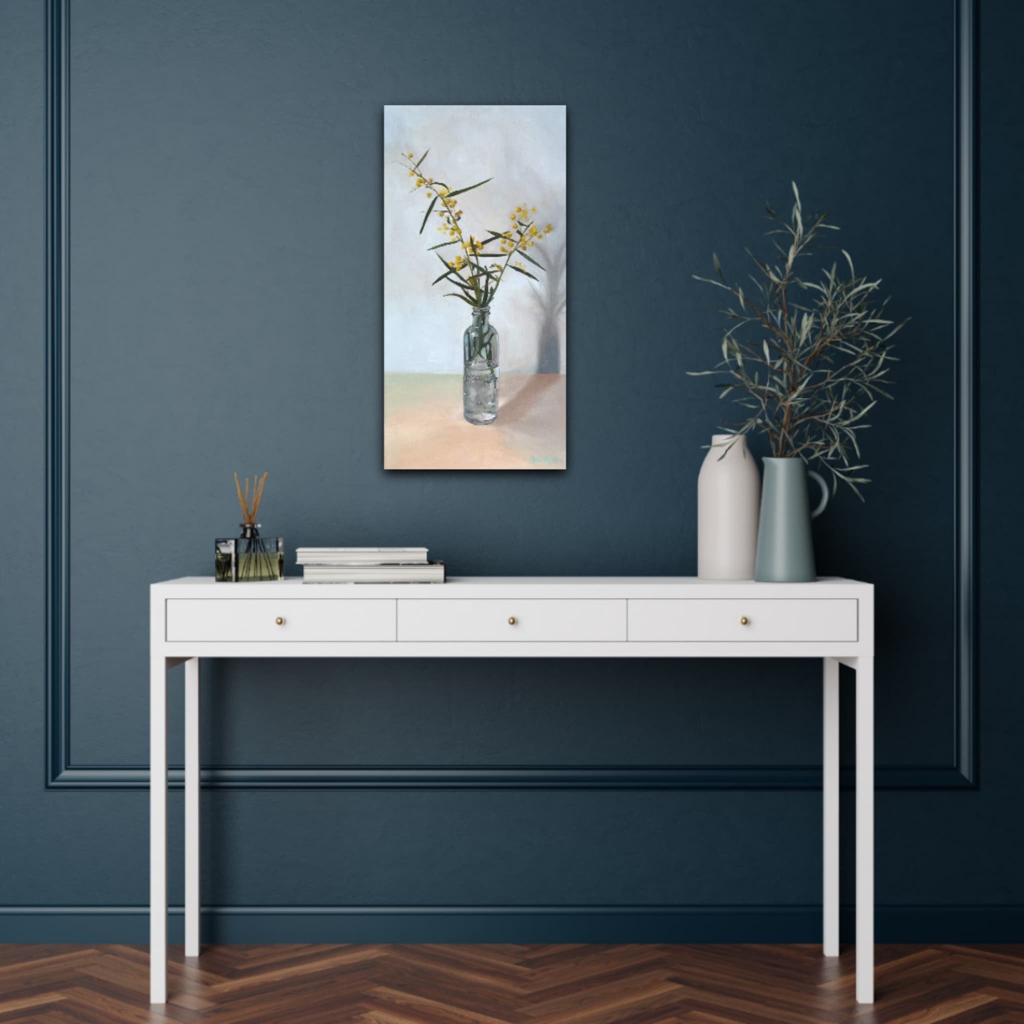 Fuzzy Wattle on a dark blue wall above a console table
