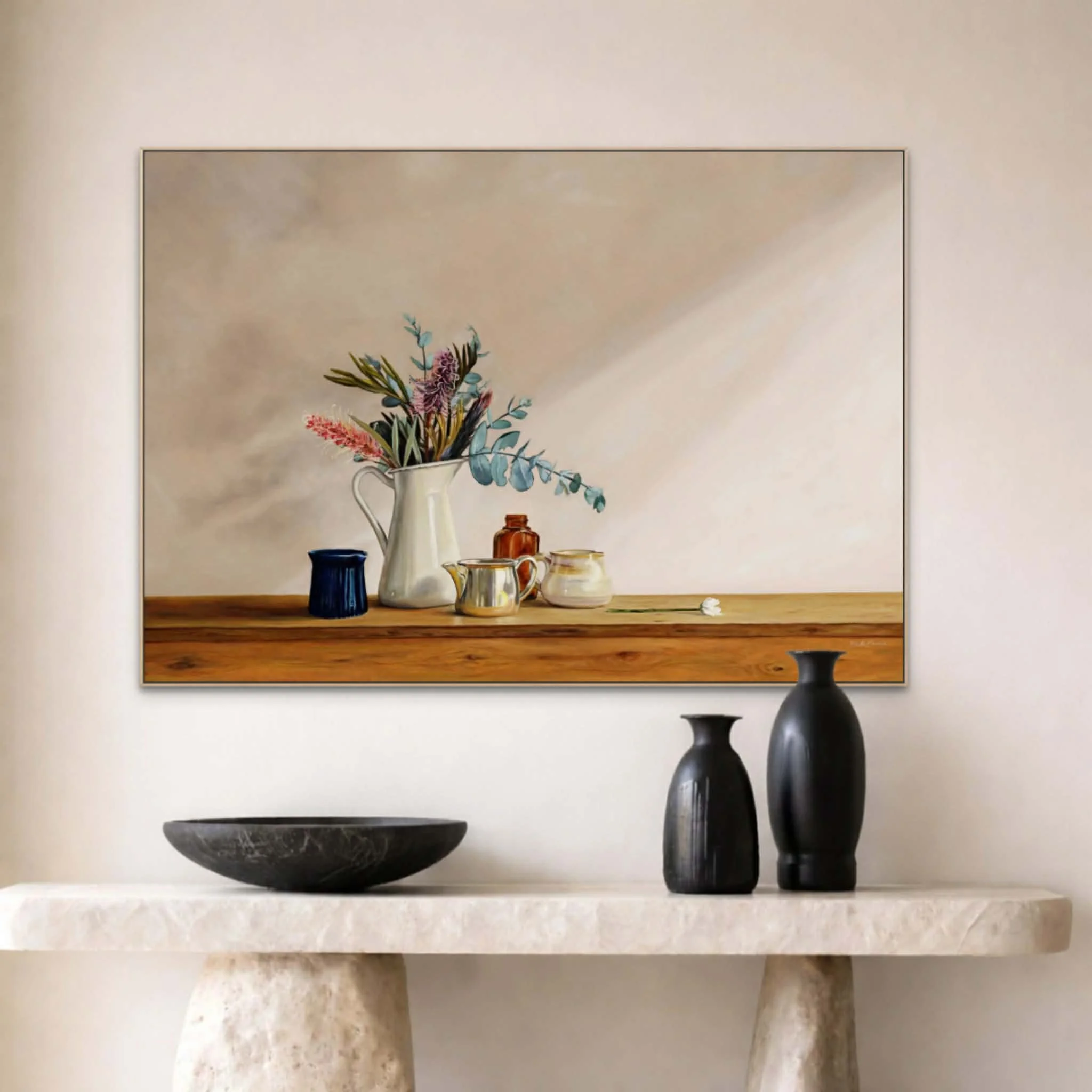 Still life by Heidi Emma called Settled positioned above a stone bench with modern black ceramics