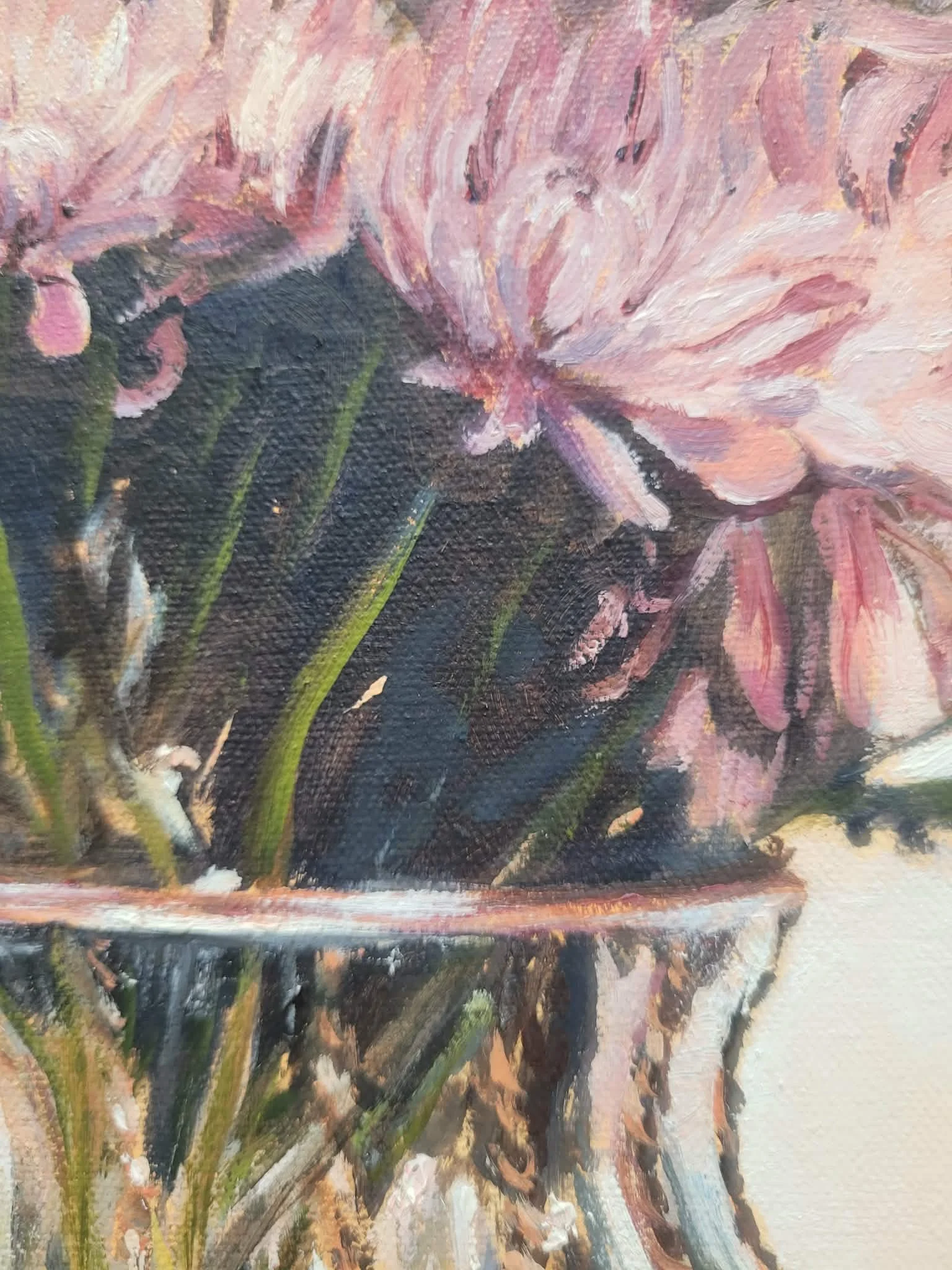 close up details of brushwork in original oil painting of soft pink chrysanthemums arranged in a clear glass vase on a timber table by Australian artist Heidi Emma.