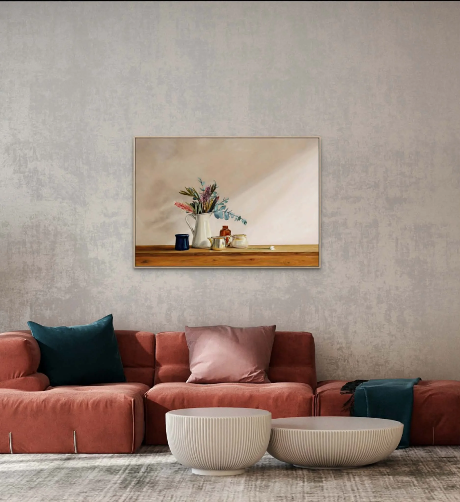 Settled on a living room wall with a deep earthy pink coach that matches the tones of the grevillea flowers in the arrangement
