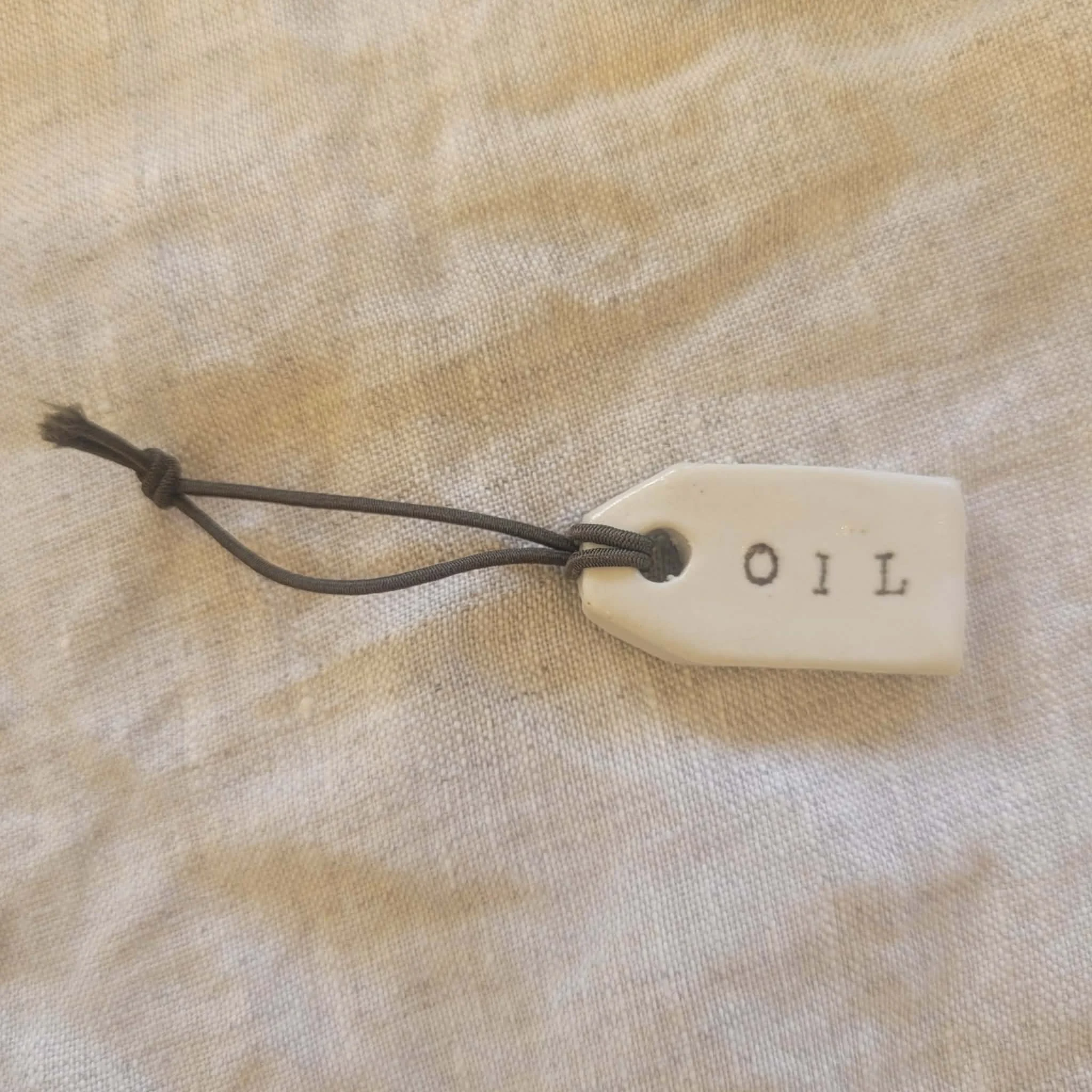 ceramic-bottle-tag-oil-my-earthy-life.jpg