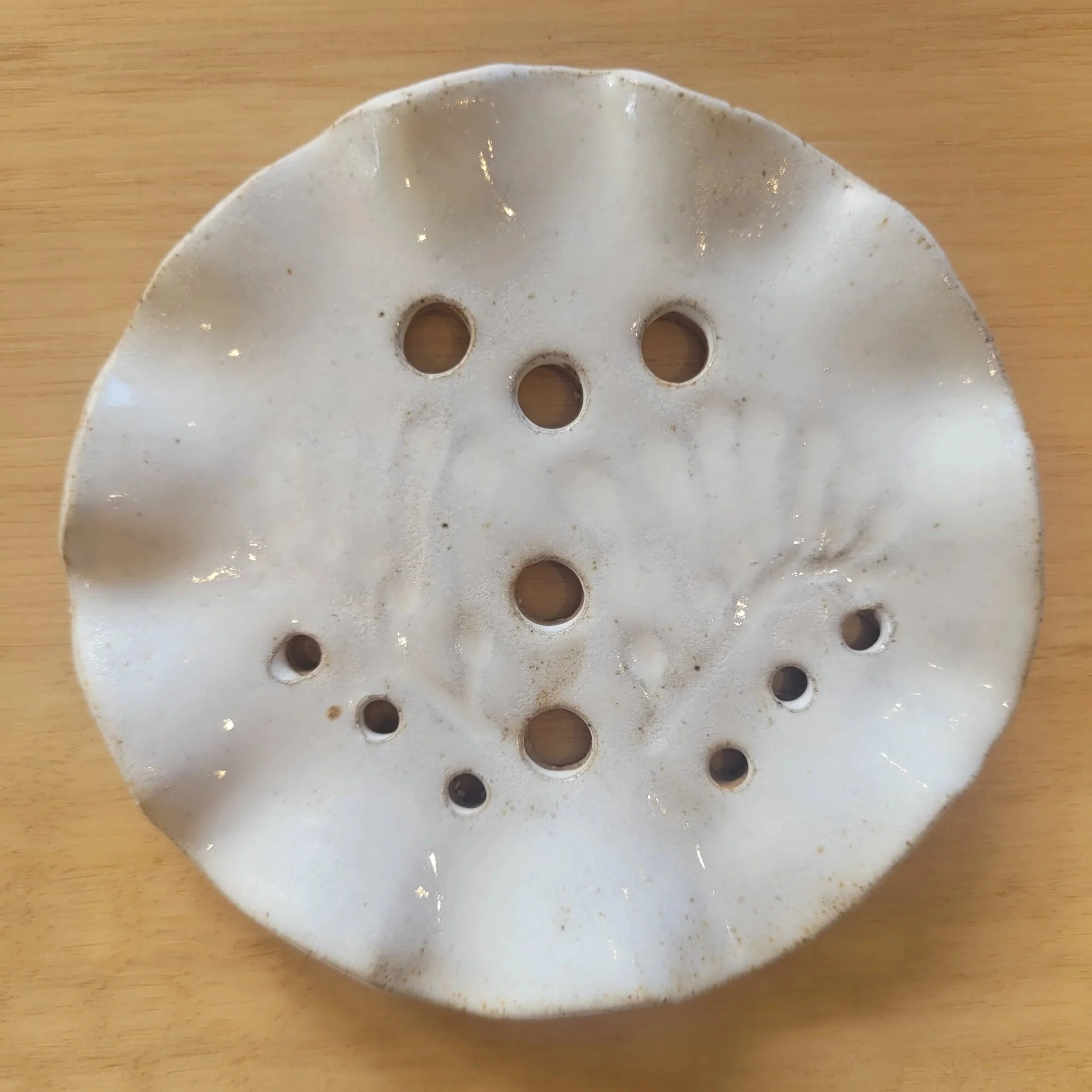 Morning Mist handmade ceramic propagation rest with Australian kangaroo paw botanical imprint in a soft warm white glaze.