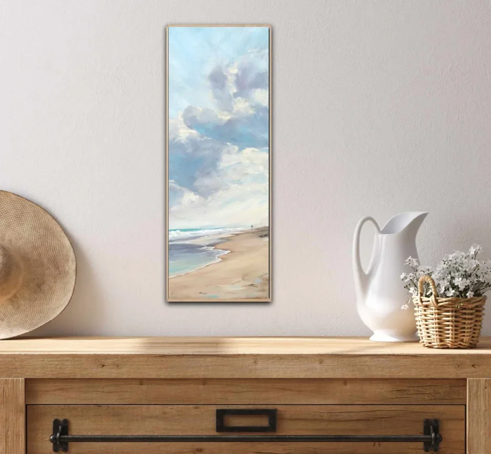 Stretched canvas print of Serenity by Heidi Emma framed in oak and hanging above a country style buffet with farmhouse styling.