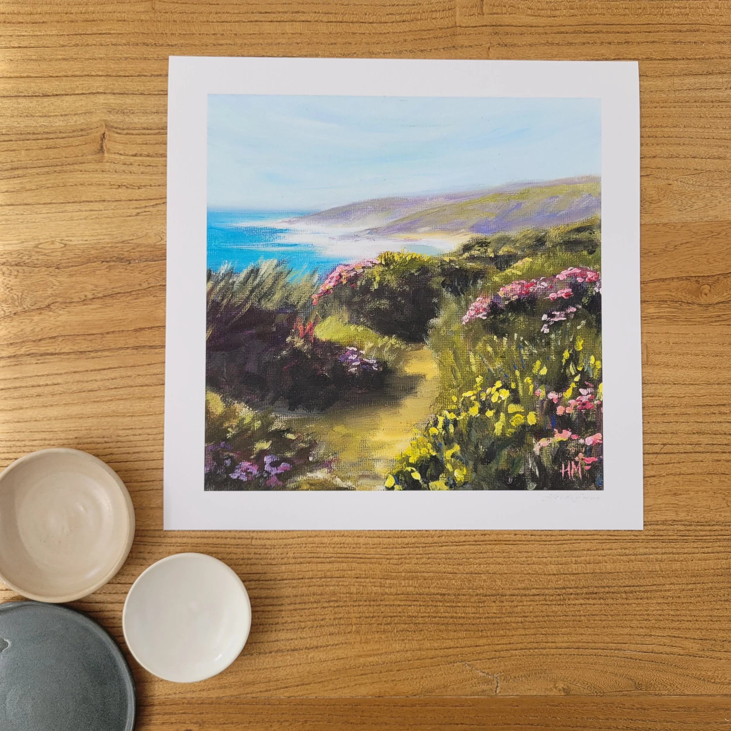 Mini Wildflower Walk shows a spring pathway along the Cape to Cape track here shown on an oak table with ceramic bowls