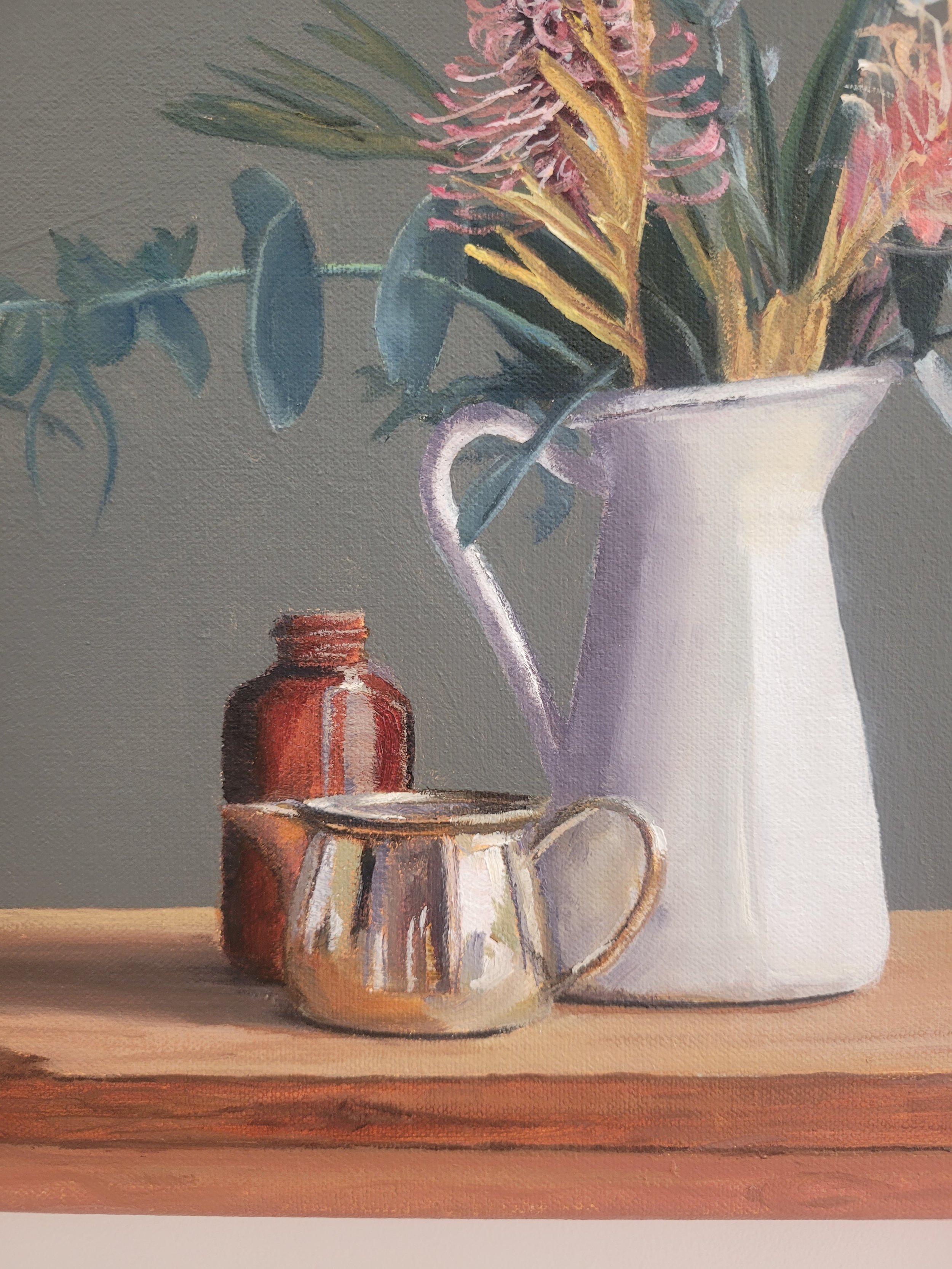We're Better Together features a moody muted green grey background with favourite enamel glass and metal vessels and Australian native flowers and foliage