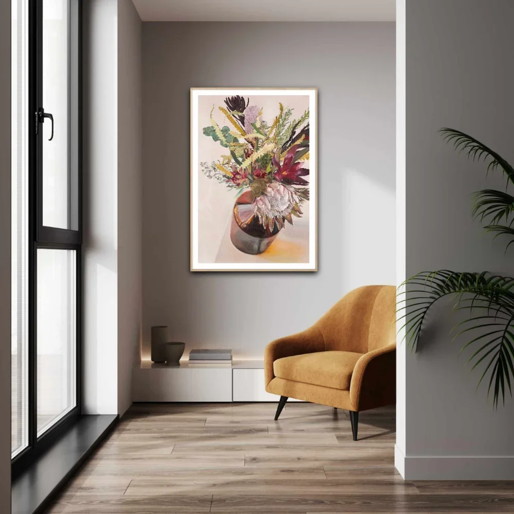 New Perspective paper print with white border framed in oak and hanging in a cozy modern reading nook.webp