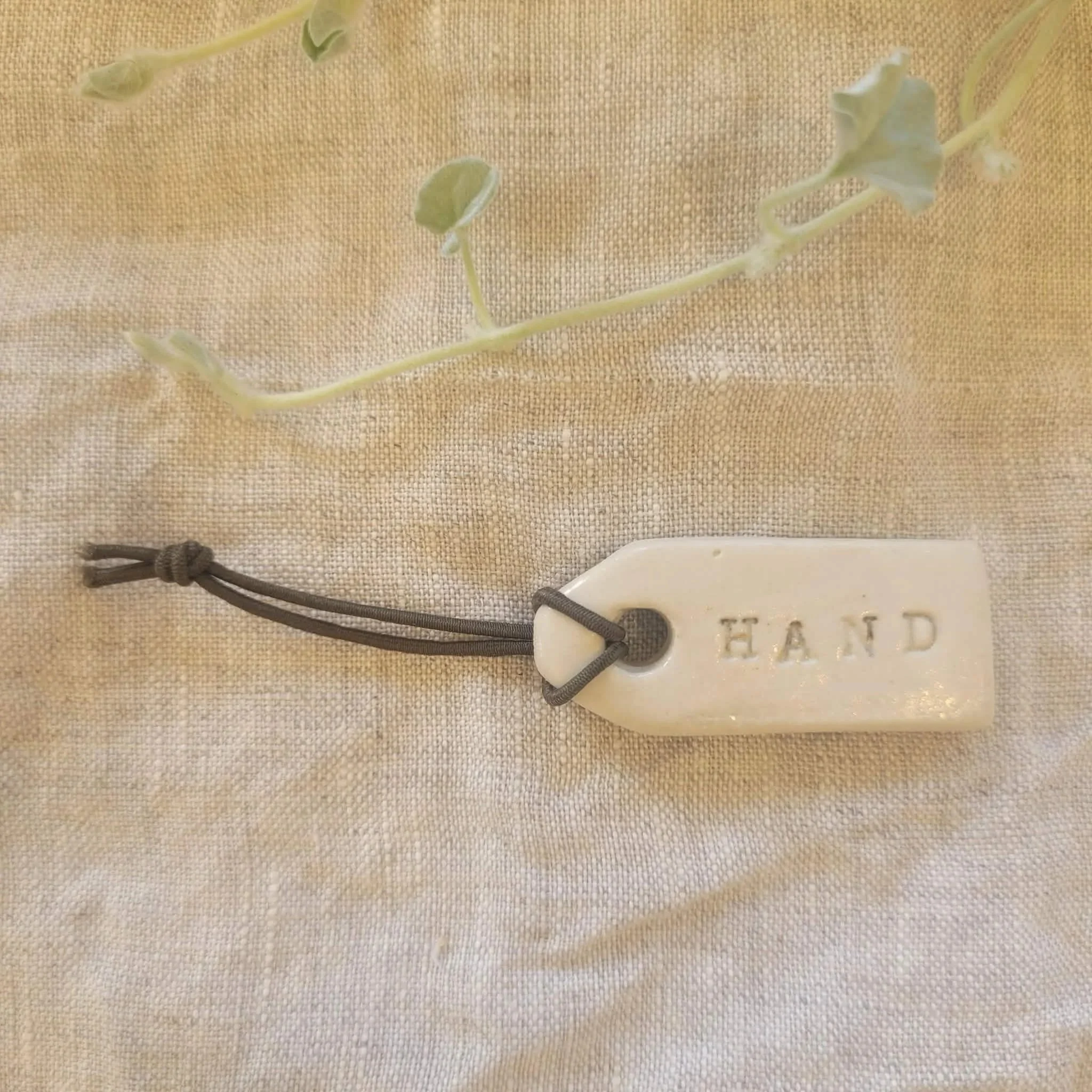 Hand — Ceramic Bottle Tag