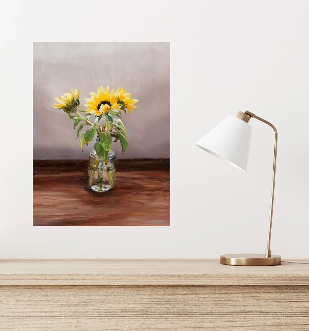 Rachel's Posy hanging above a desk with lamp.webp