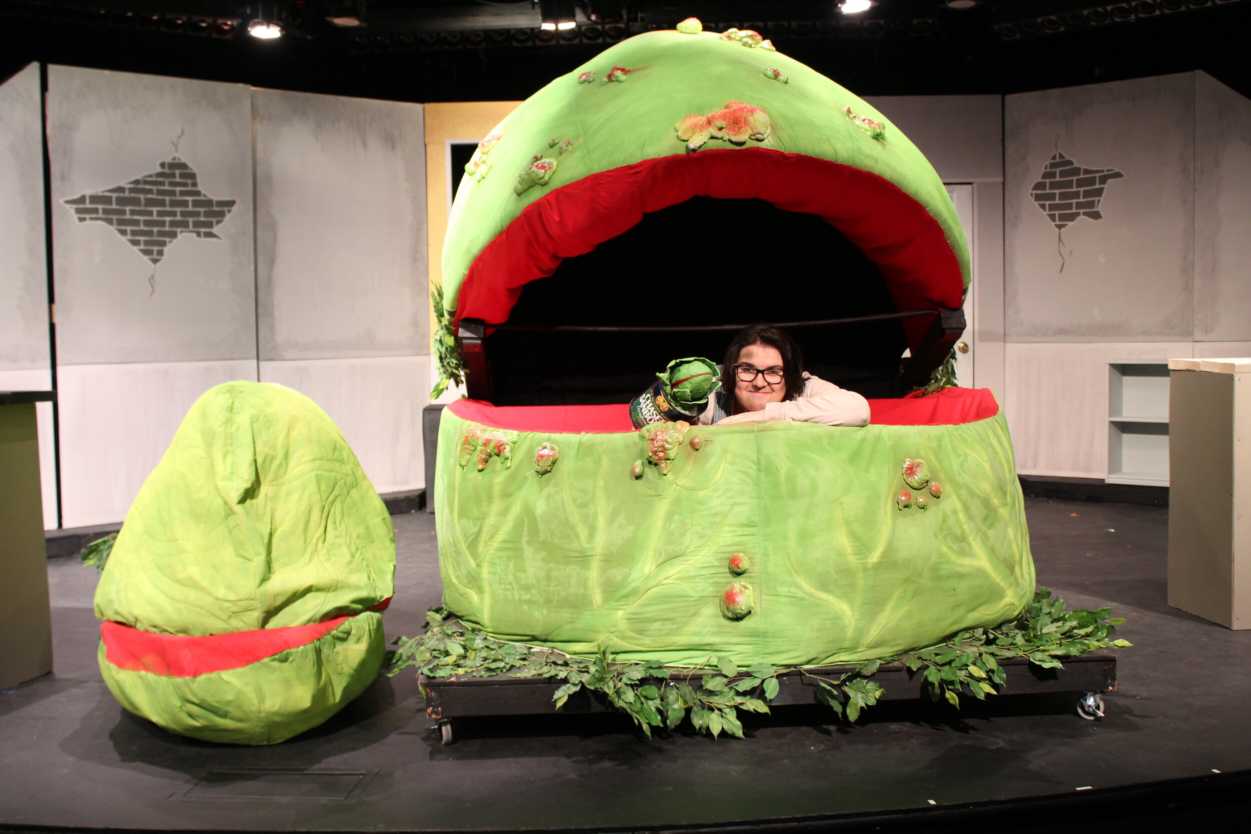  Puppeteer Lucas Ries posing with the full gamut of plant puppets 