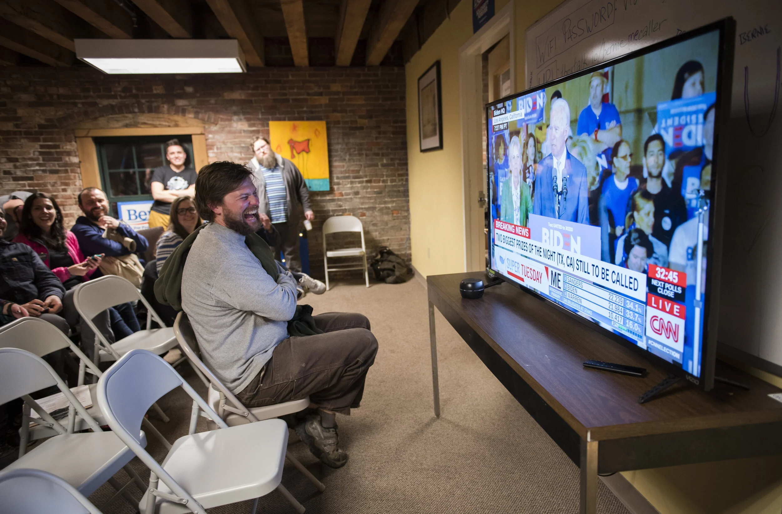  Alex Hatch of Portland, a Bernie Sanders supporter, reacts while watching Joe Biden's speech at a Super Tuesday results watch party at the Sanders campaign headquarters in Portland on Tuesday, March 3, 2020.  