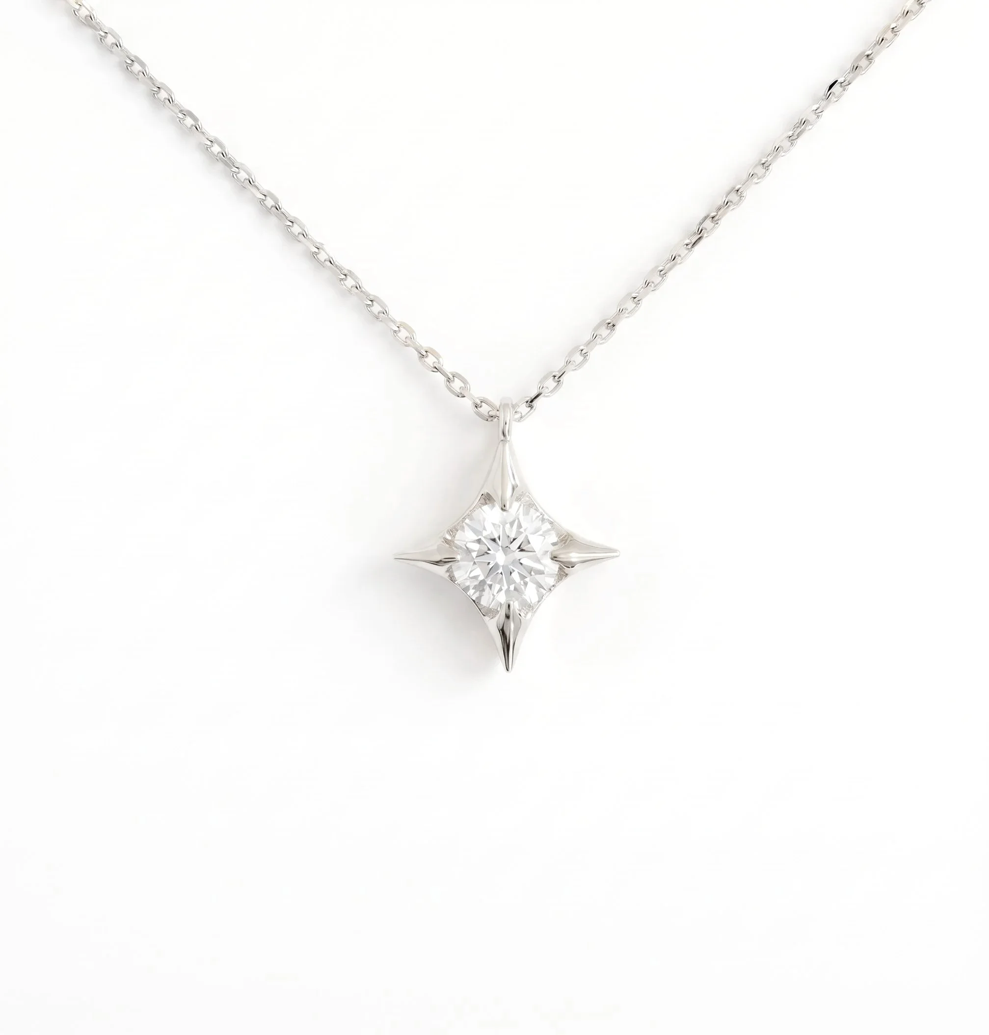 Diamond+Four-pointed+Star+Pendant+in+18ct+White+Gold.jpg