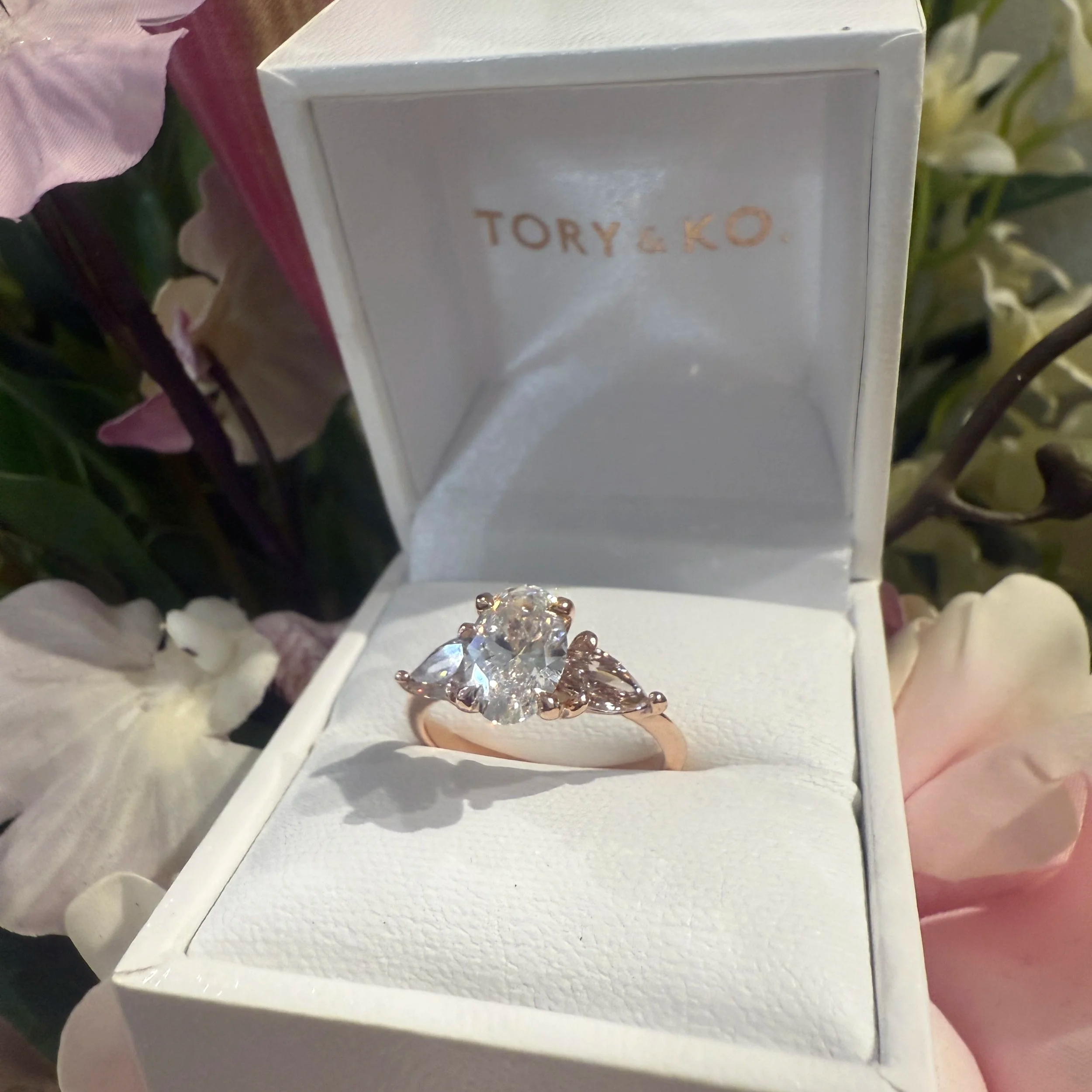 Holiday+Jewellery+14ct+Rose+Gold+Oval+lab+grown+diamond+with+pink+lab+grown+pear+diamond+shoulders+in+box.png