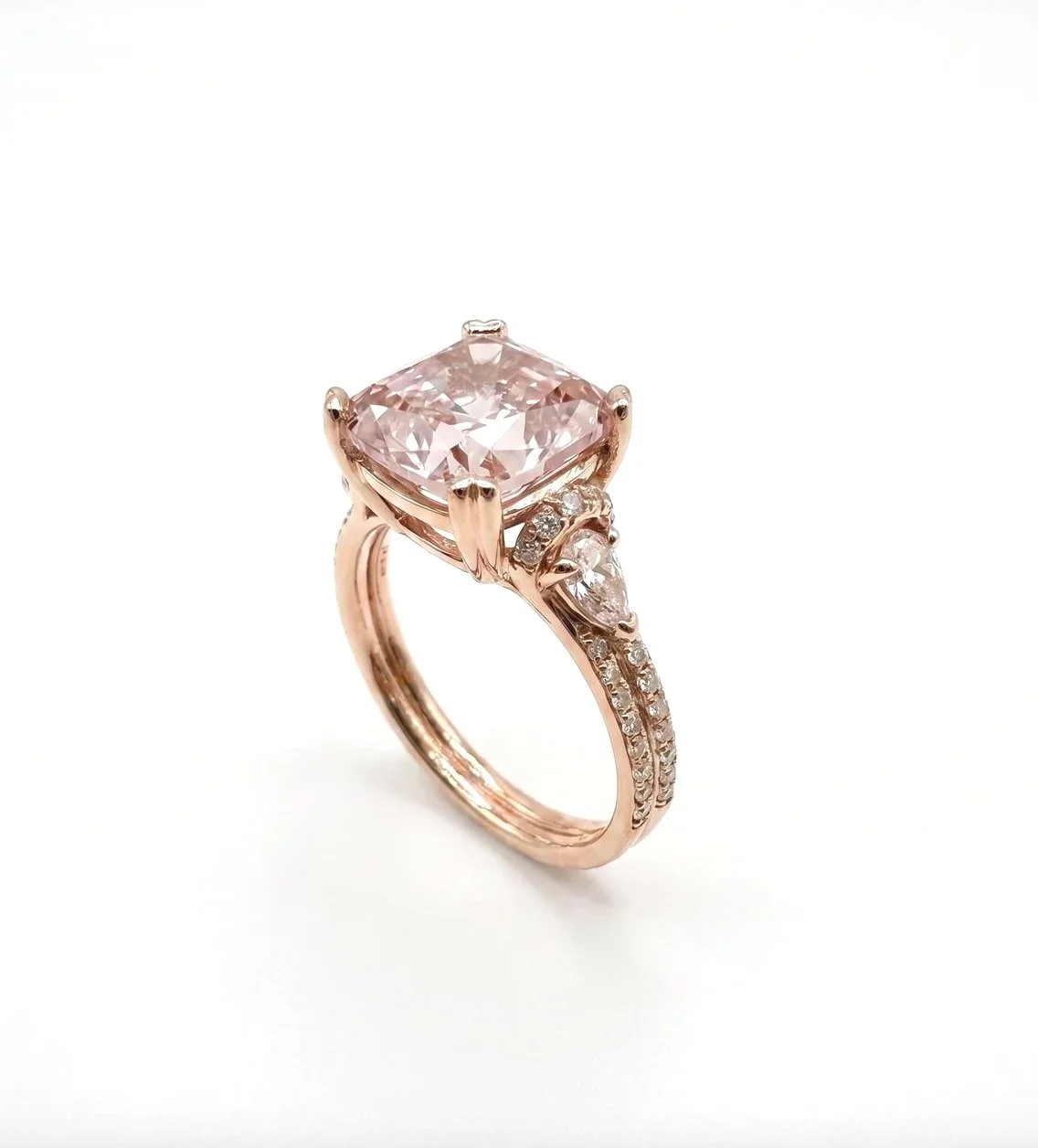 Pink+Cushion+cut+Diamond+with+pear+cut+and+french+set+diamond+shoulders+in+14ct+Rose+Gold.jpg