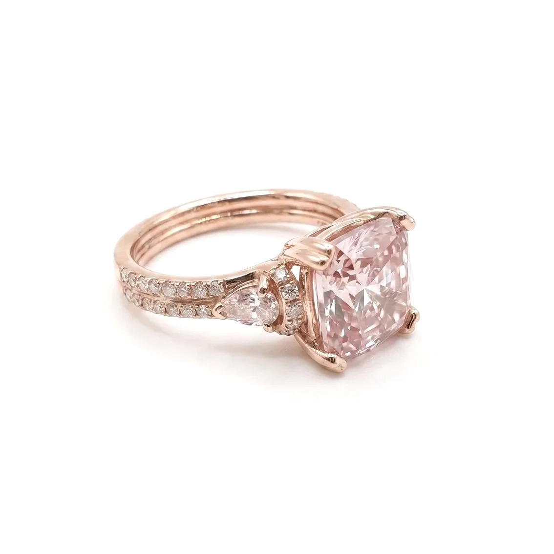 Pink+cushion+cut+diamond+ring+with+pear+cut+and+french+set+diamond+shoulders+14ct+Rose+gold+on+side.jpg