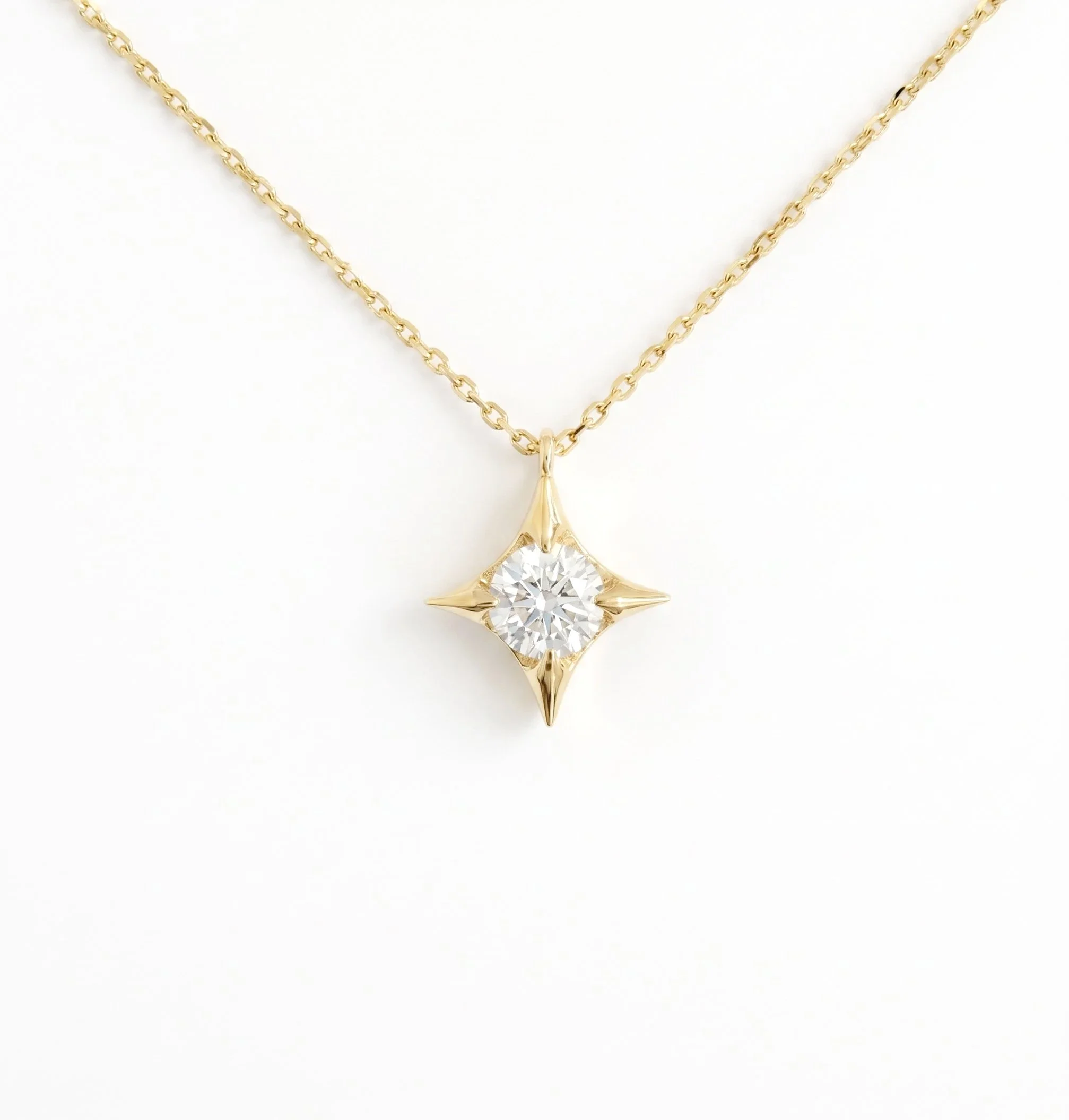 Diamond+Four-pointed+Star+Pendant+in+18ct+Gold.jpg