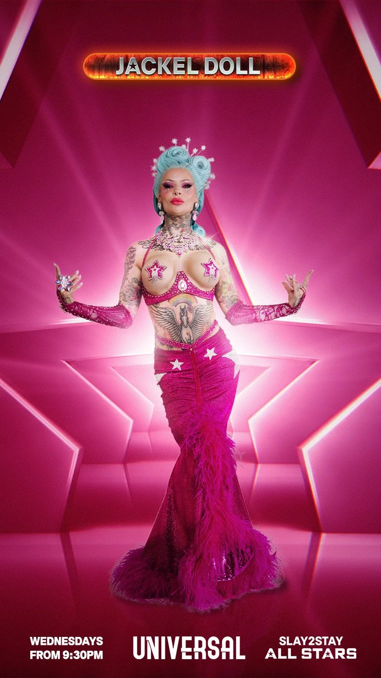 Promotional poster for Jackel Doll, a show on Universal Network, starting Wednesdays at 9:30 PM, featuring a tattooed drag performer with blue hair, dressed in a pink star-themed outfit with feathers and sequins.