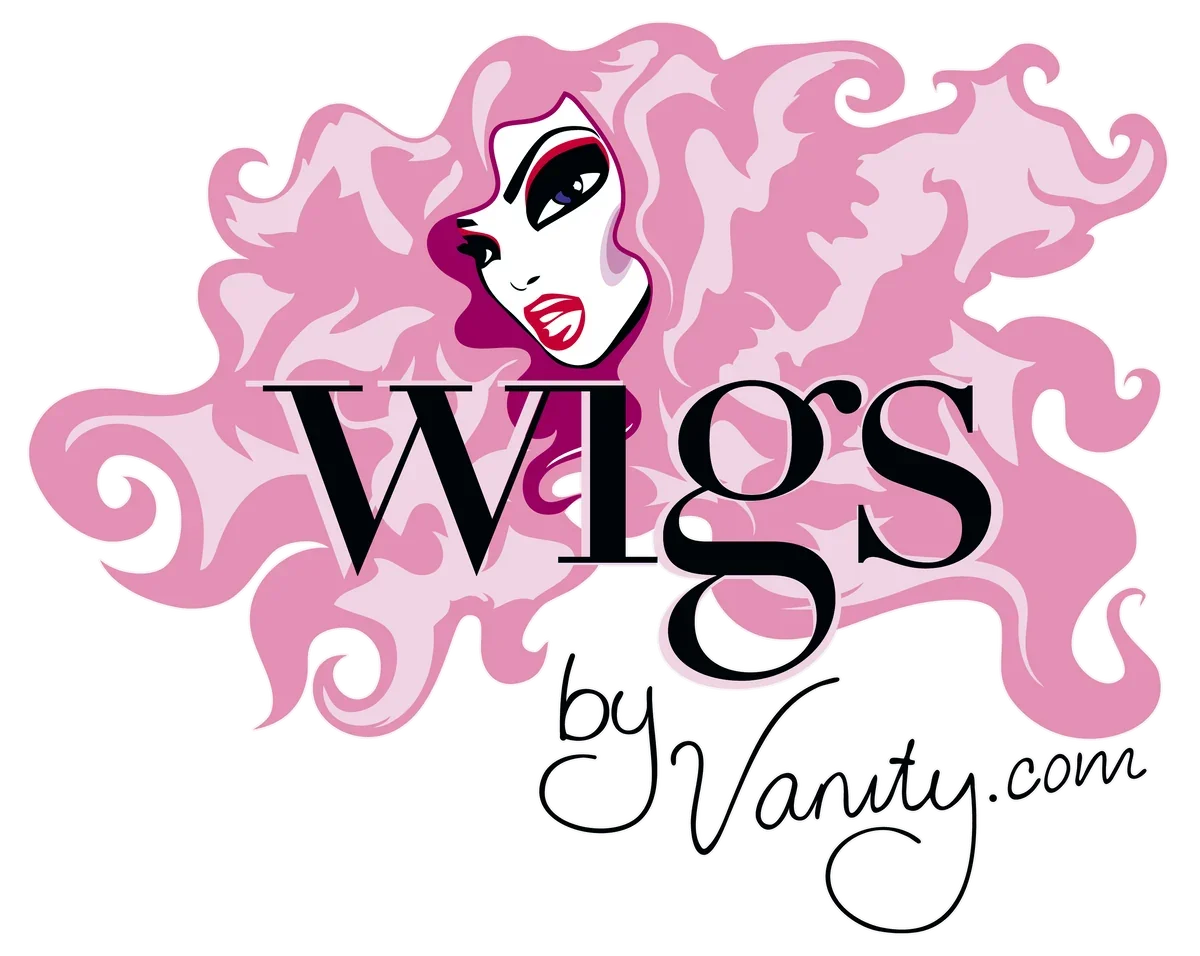 A stylized illustration of a woman with pink, curly hair and fierce makeup, with the text "Wigs by Vanity.com" prominently displayed.