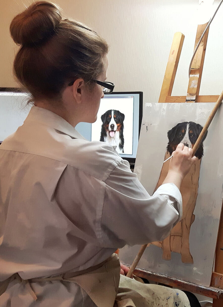 Kate painting by her easel.jpeg