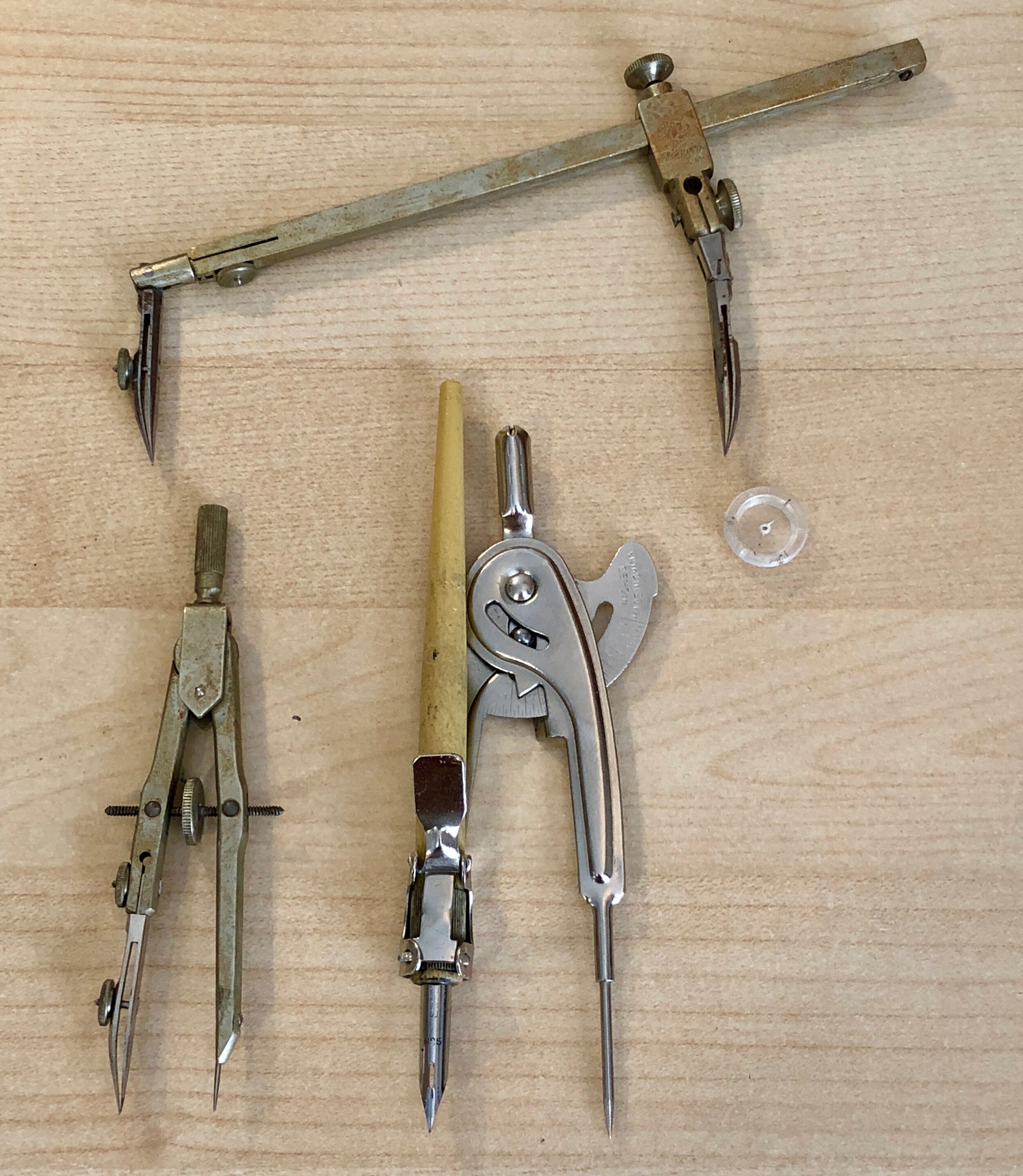 Various compasses for drawing with ink