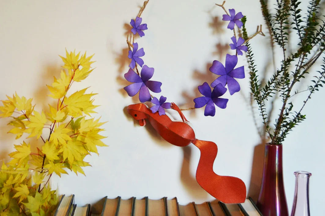Red squirrel on purple floral branch.jpg