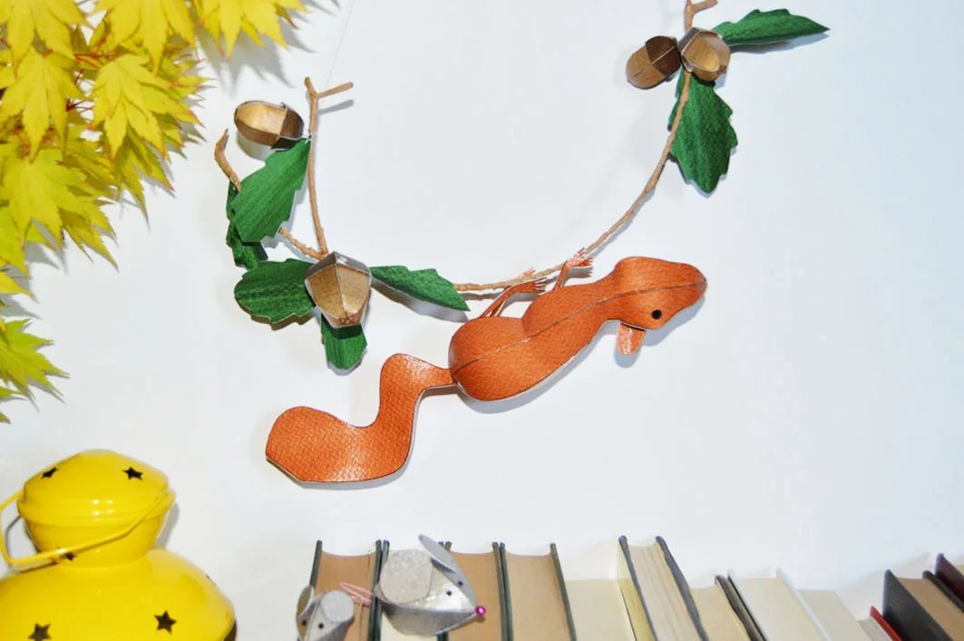 squirrel pup sculpture on acorn branch 2.jpg
