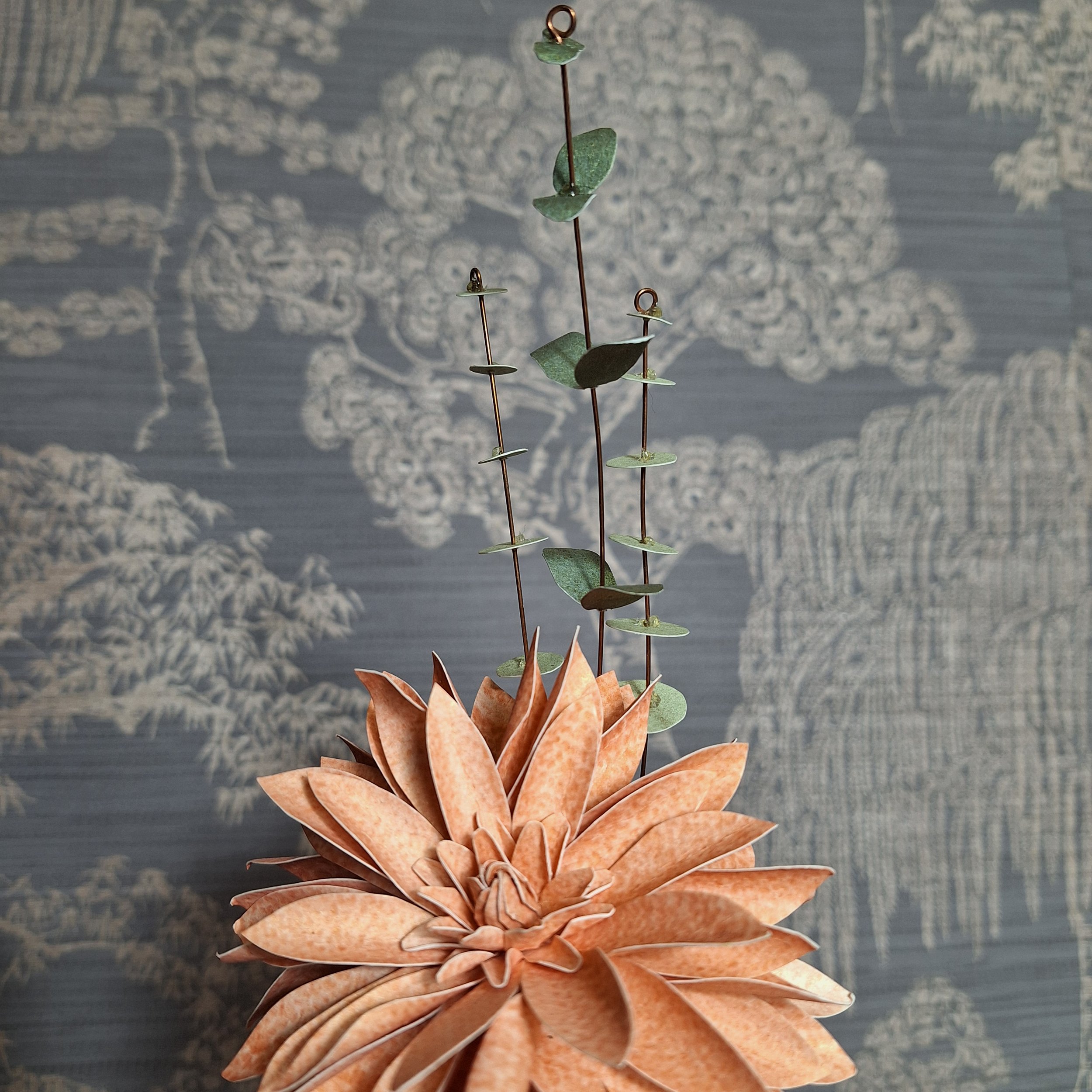 paper flower art of a dahlia in peach