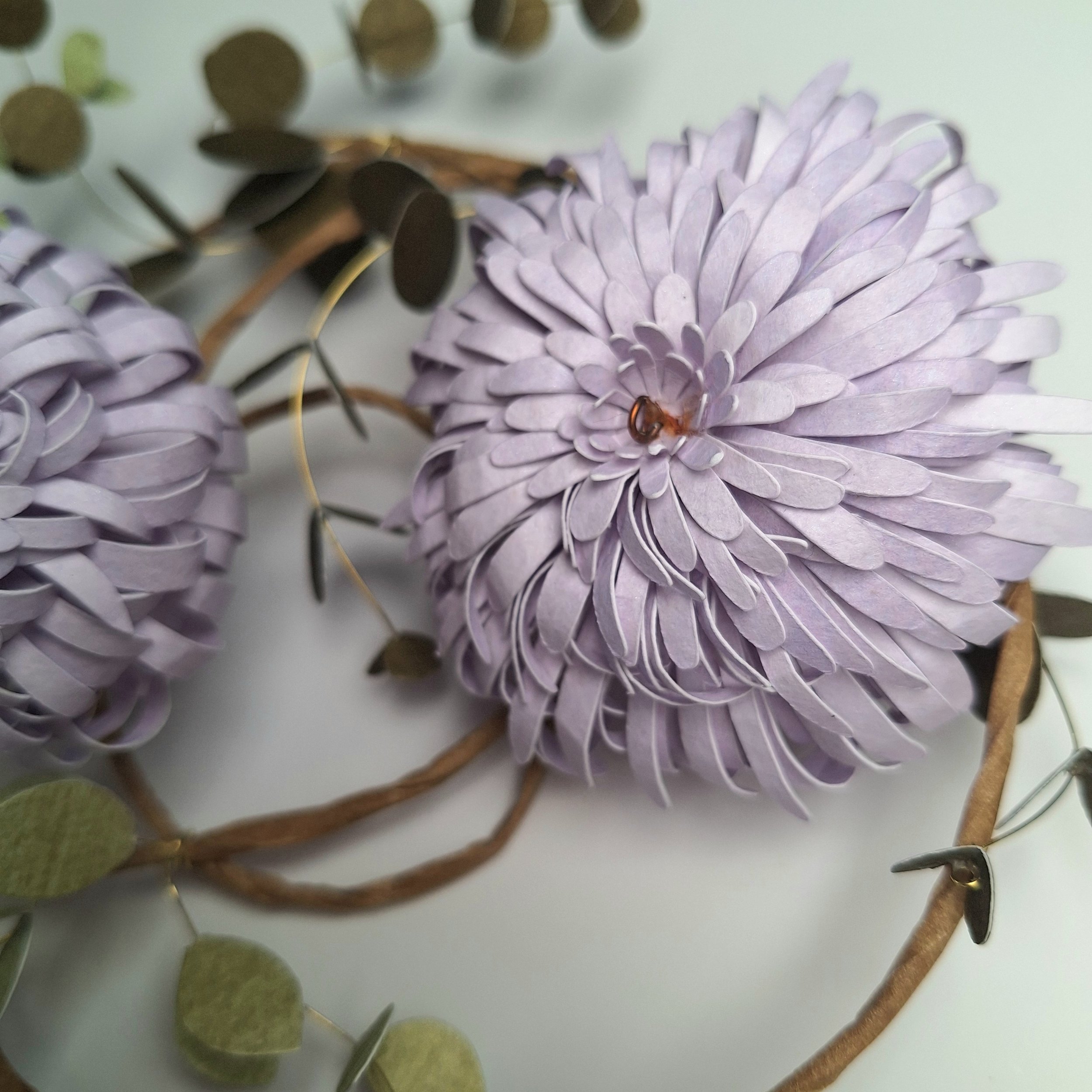 close up of a purple chrysanthemum flower, made from hand-printed papers