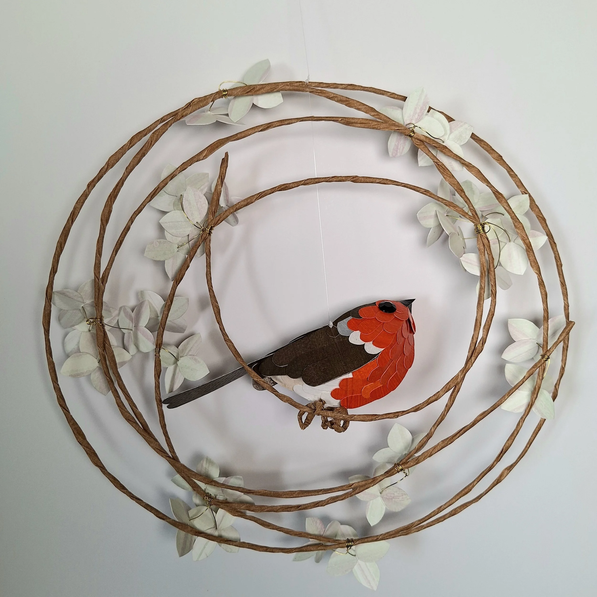 Back view of the robin wreath sculpture.