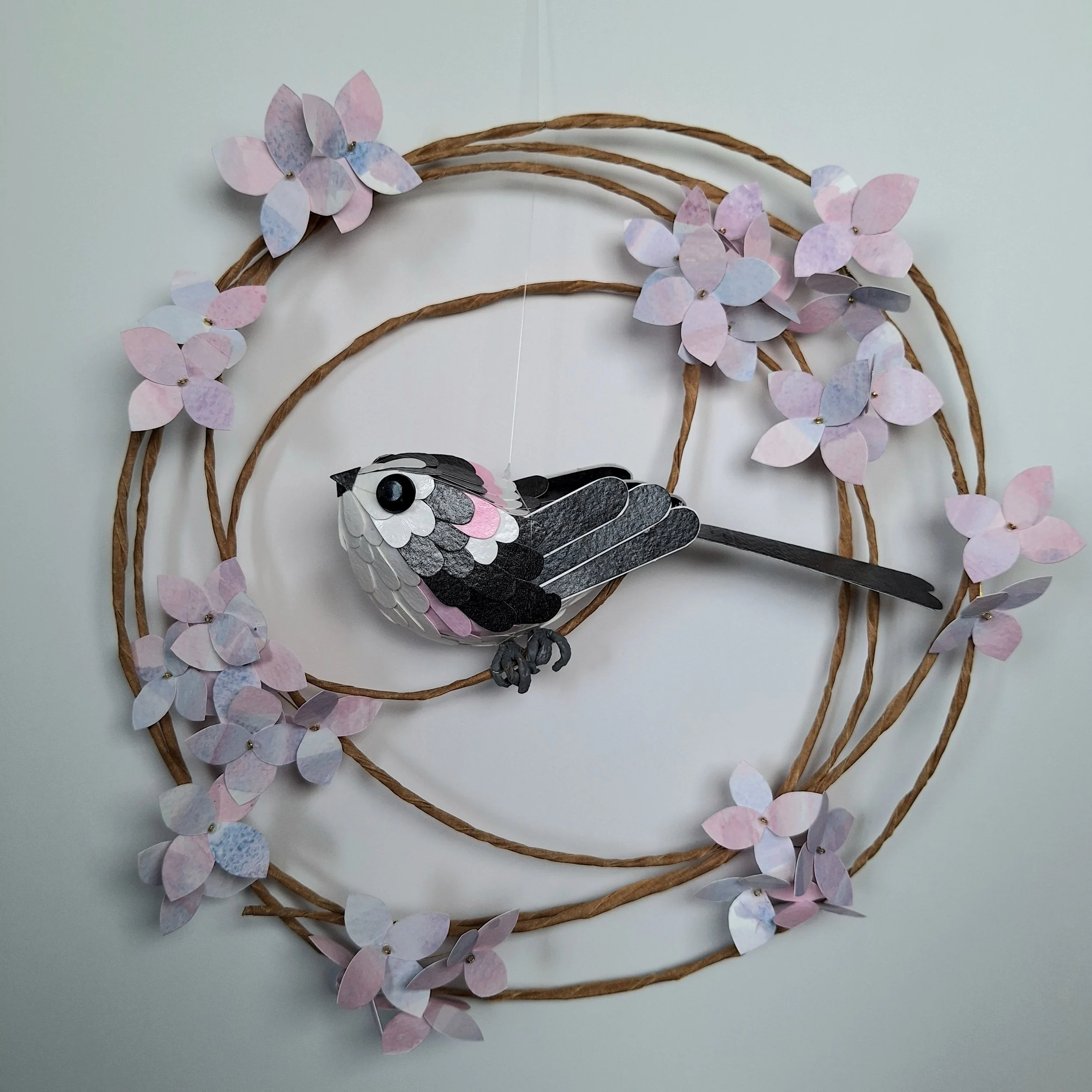 Long Tailed Tit on a pink and white hydrangea wreath
