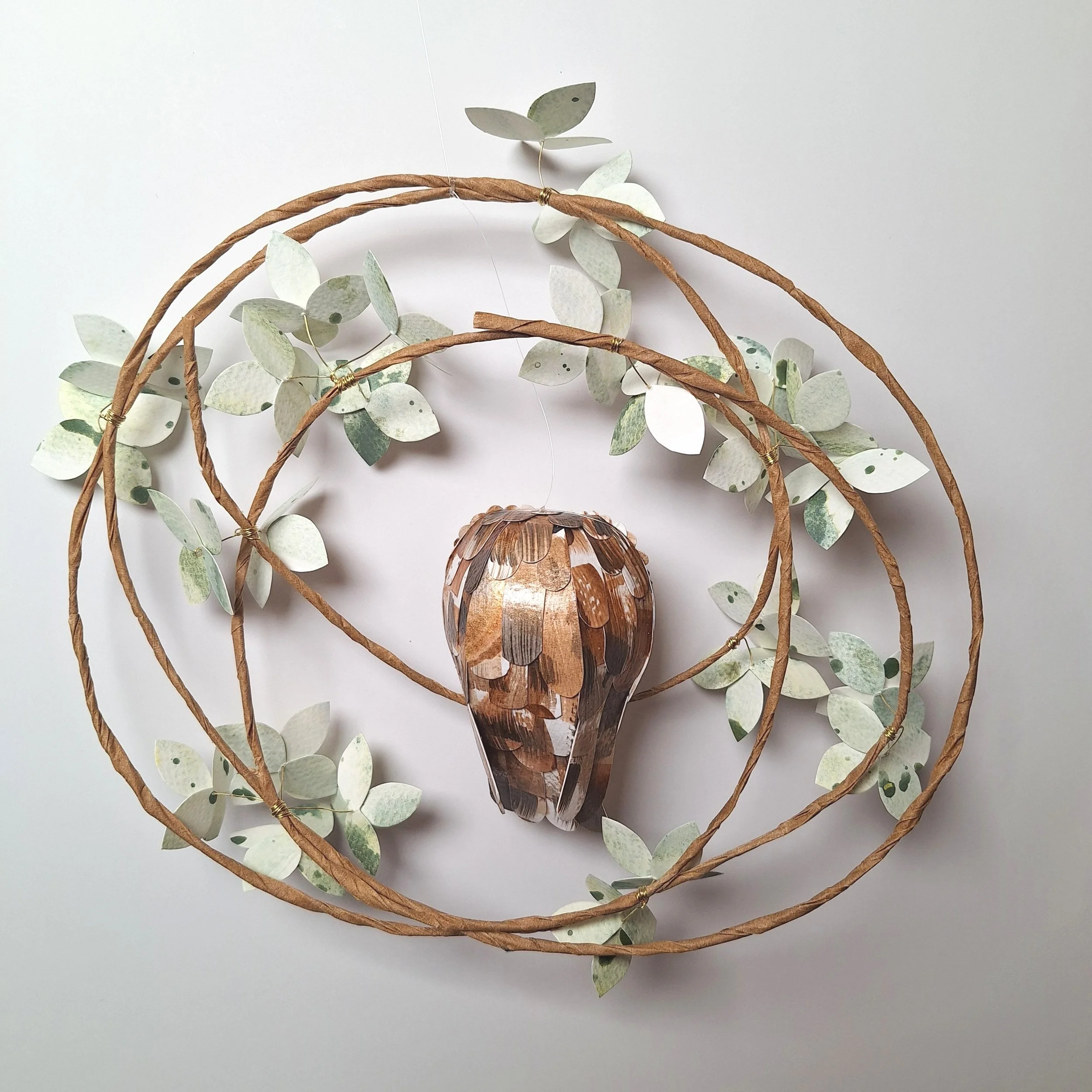 back view of a baby tawny owl sculpture