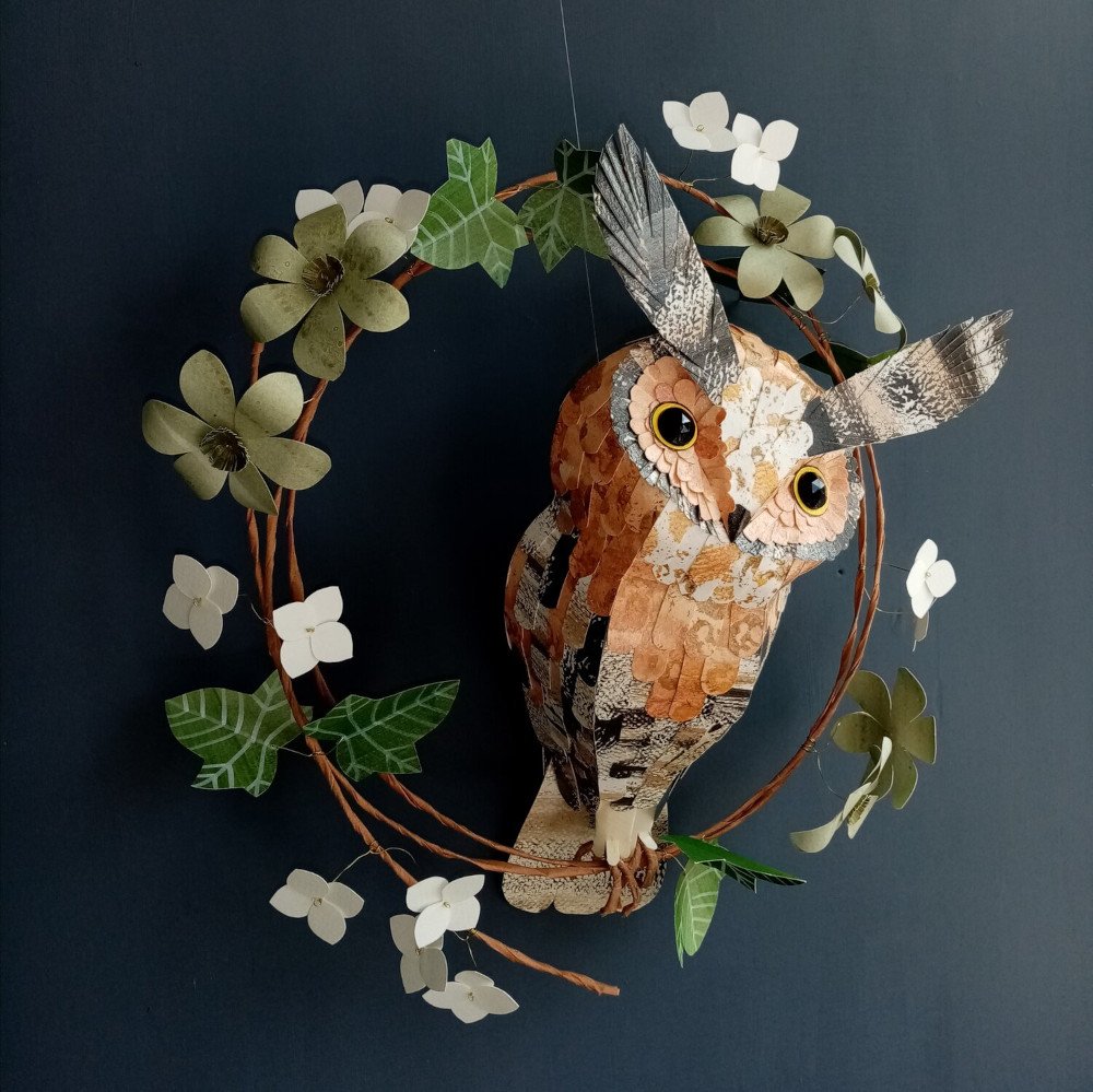 Decorative wreath featuring a paper owl and leaves