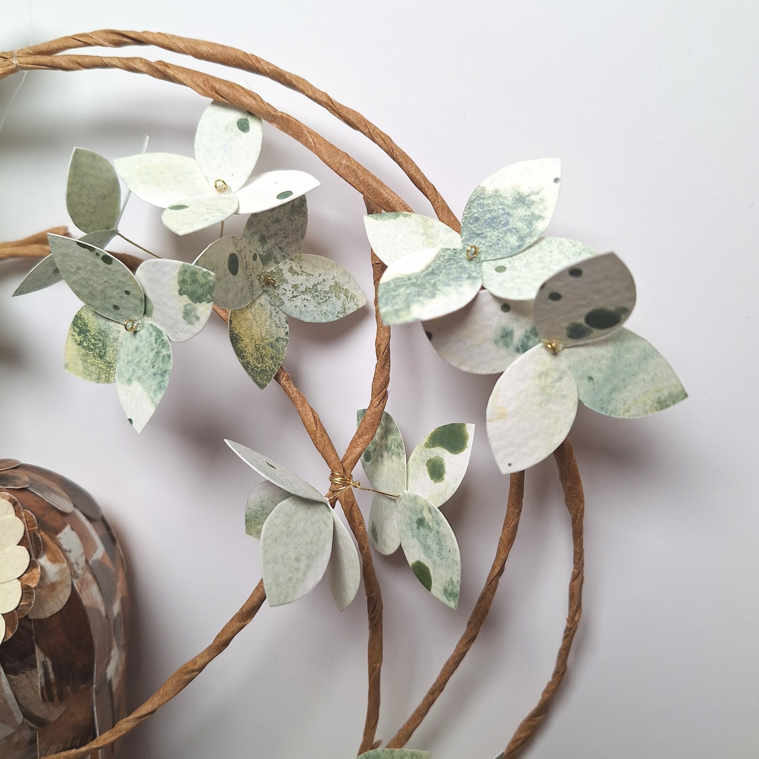 close up of the mottled green and white hydrangea blooms on the spring wreath