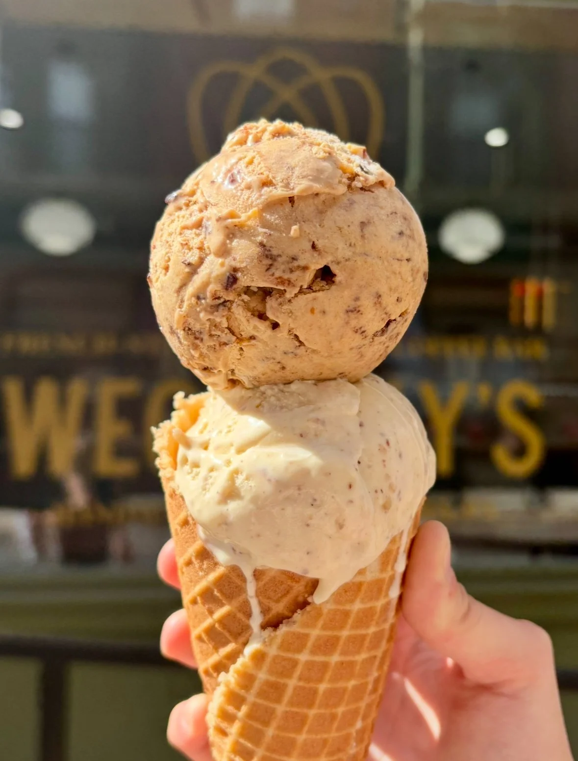 Double scoop of Pumpkin Mocha and Almond Croissant ice cream in a house-made wafle cone